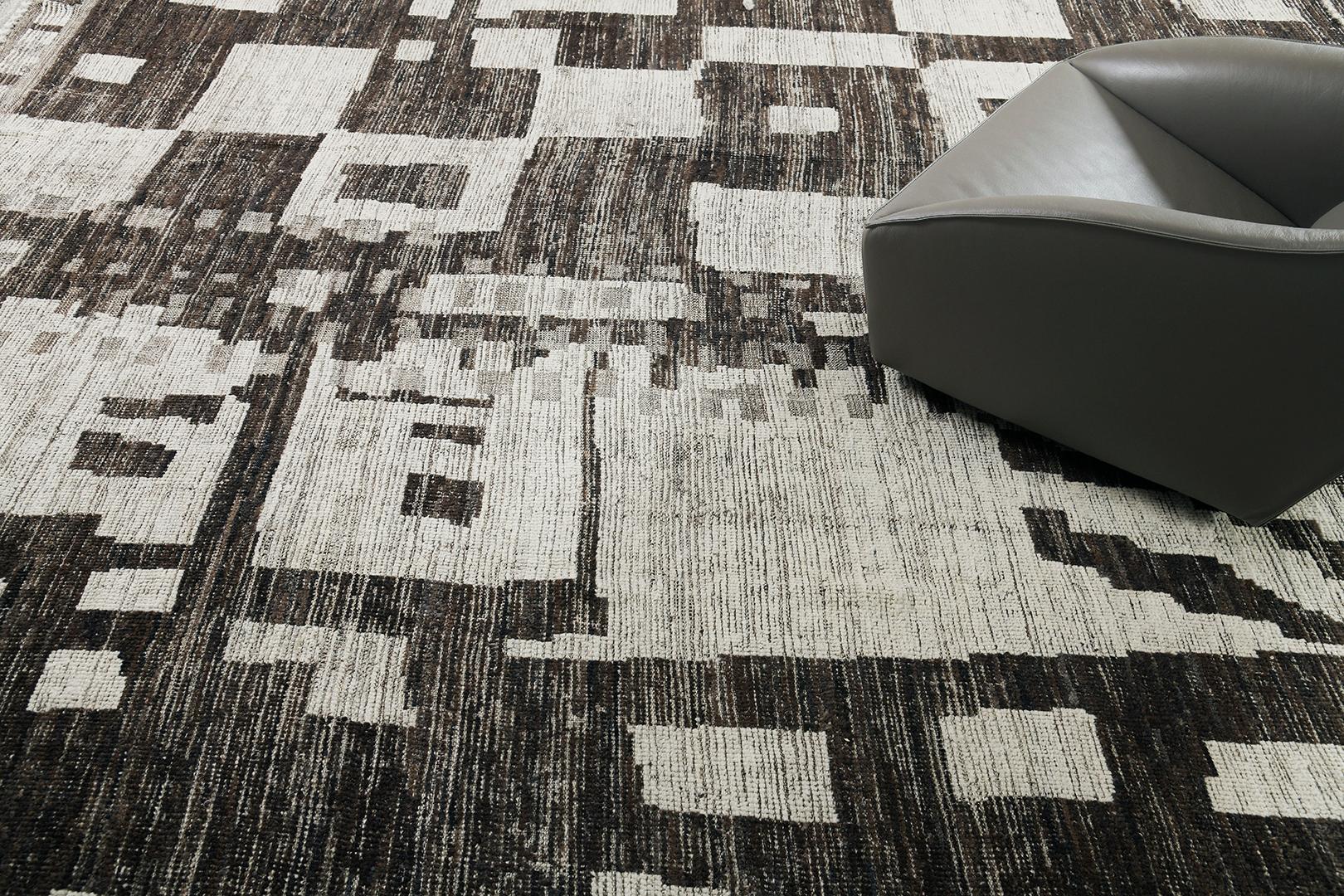 Tament’ features a series of irregular shapes cohesively formed together creating a masterful piece that is very much suited for contemporary homes. Umber brown and cedar blends perfectly emanating a bewildering piece. Mehraban's Atlas collection is