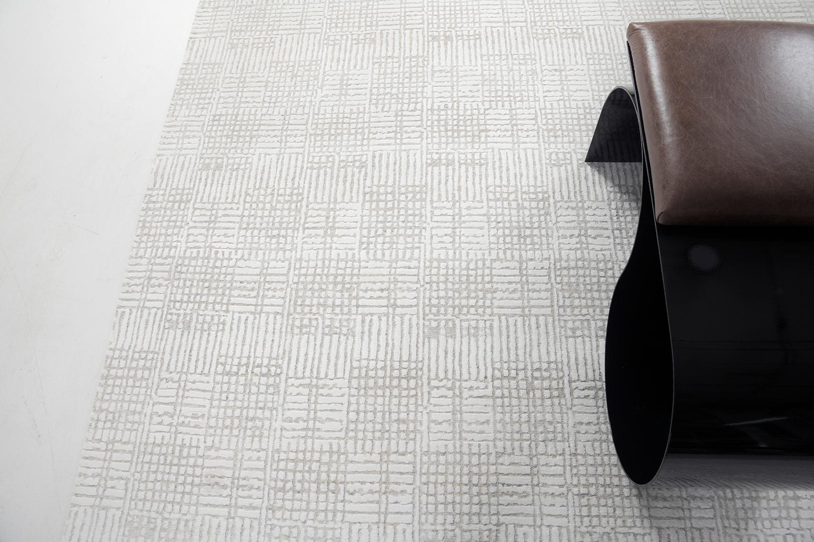 Tappa is a gorgeous bamboo silk that features an embossed patterned rug in a neutral-toned scheme. It brings your home pristine and elegant interiors. Elan collections are a must-have on your list when it comes to modern and contemporary home