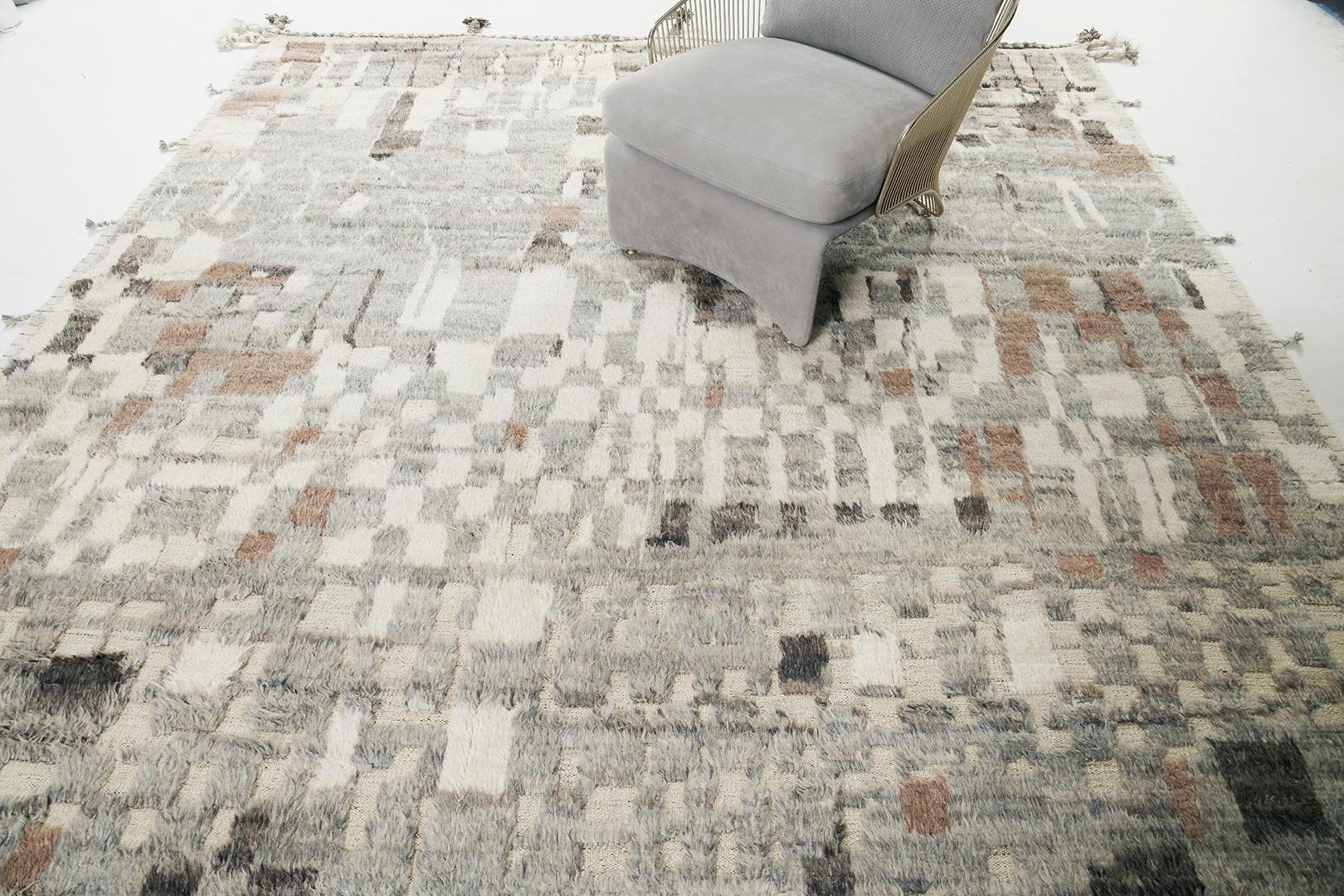 Teewa’ emanates elegant sophistication through its ambiguous symbollical elements represented in this alluring modern rug. Featured in the stunning shades of ivory, gray, gingerbread and charcoal, this rug exudes mesmerizing impact through each