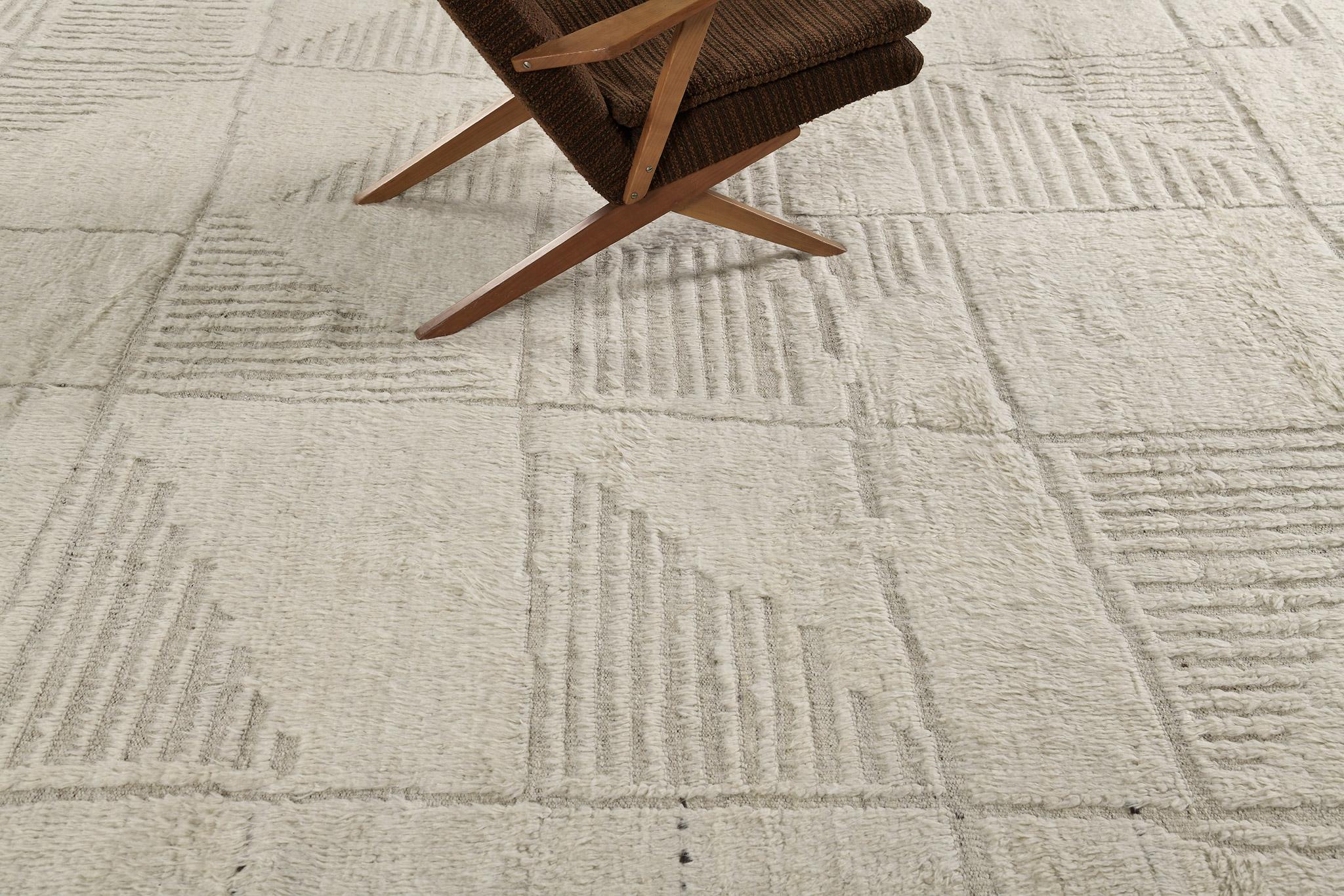 Tisent is beautiful embossed wool that features different linear strokes. Its neutral tone will complement your modern contemporary interior and will soothe the eyes of your guests. This rug plays with textures, linework, and simplicity which makes