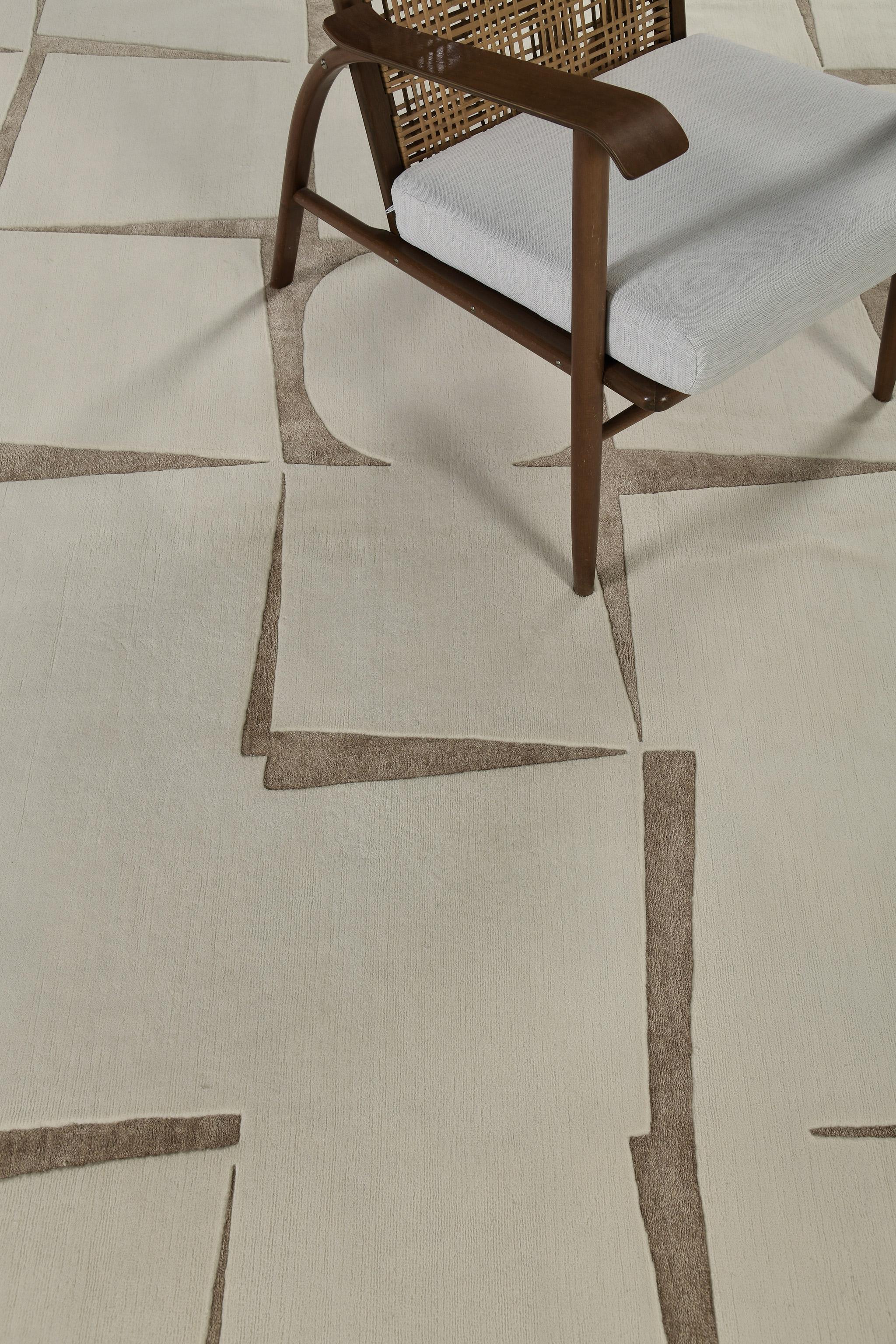 Toccato features stacked geometrical patterns depicting aesthetic artistry. It is a part of the Design Rhymes Collection which pulls inspiration from different aspects of architecture. This rug is rendered in the most soothing shade of ecru and