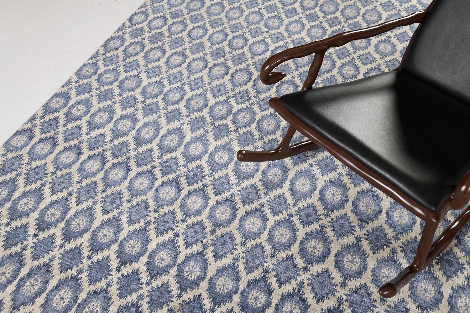 A spectacle of well-balanced symmetry in the stunning shades of cobalt blue and ivory. This fascinating rug not only capture one's stylish mind, but also adds meaning and depth due to its symbolical elements portraying protection from evil forces. A