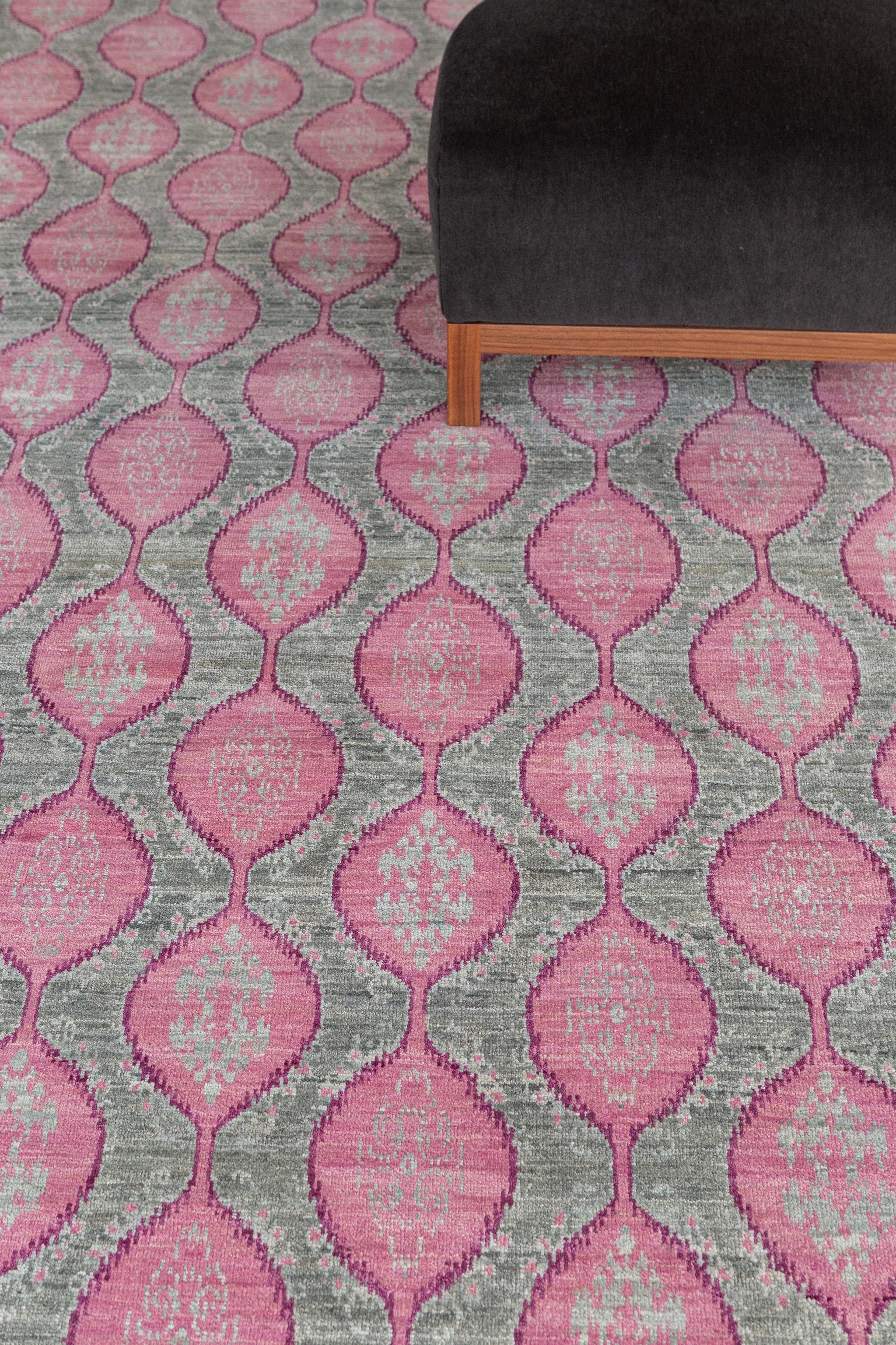 Dantelle' is a transitional design weaving traditional diamond motifs in a modern day lattice pattern. Beautiful hues of pink and green perfectly complement one another to create a magnificent rug. This piece will elevate and bring character to any