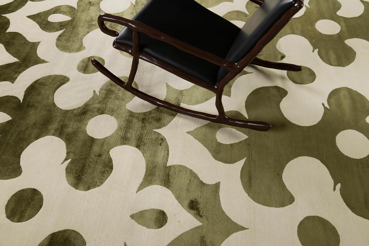 Moresco' features a stunning embossed all over pattern that brings satisfying texture to the entirety of this mesmerizing rug. Muted tones of cream and olive green complements the soothing character brought about this exquisite piece. With its