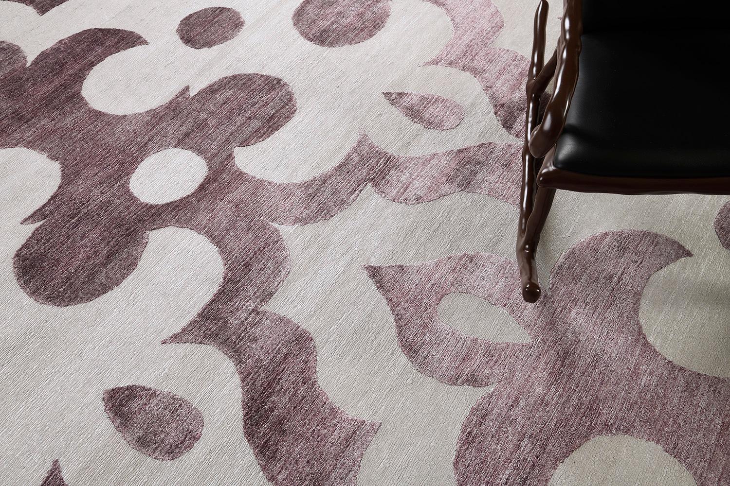 Moresco' features a stunning embossed allover pattern that brings satisfying texture to the entirety of this mesmerizing rug. Muted tones of ivory and purple orchid complements the soothing character brought about this exquisite piece. With its