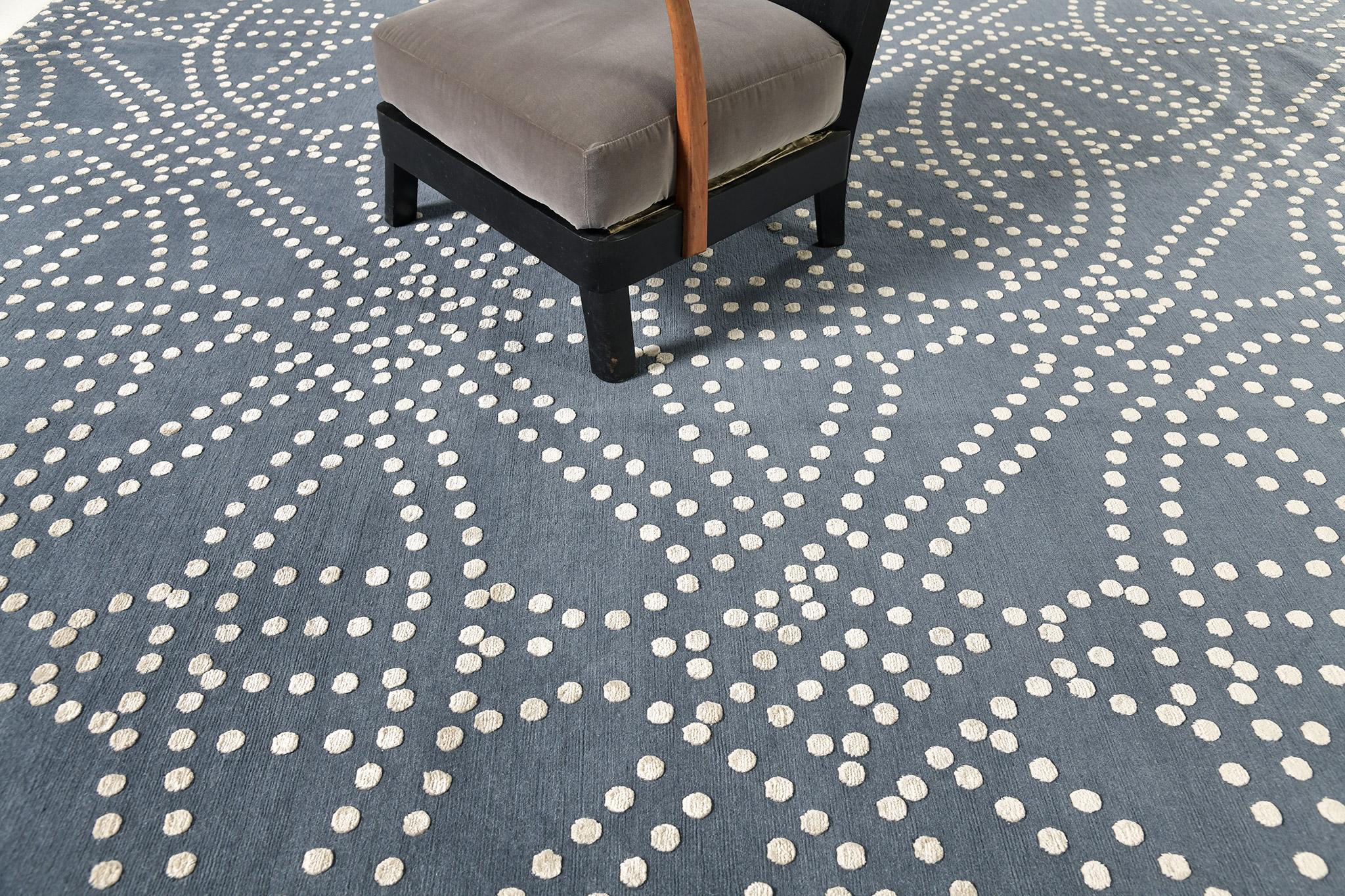 Ruote is a transitional design with seamless geometrical patterns of dotted circles. It gives a lustrous effect that can brighten the ambiance of your room. It can be an accent rug that will challenge the interior designer's creativity.

Rug