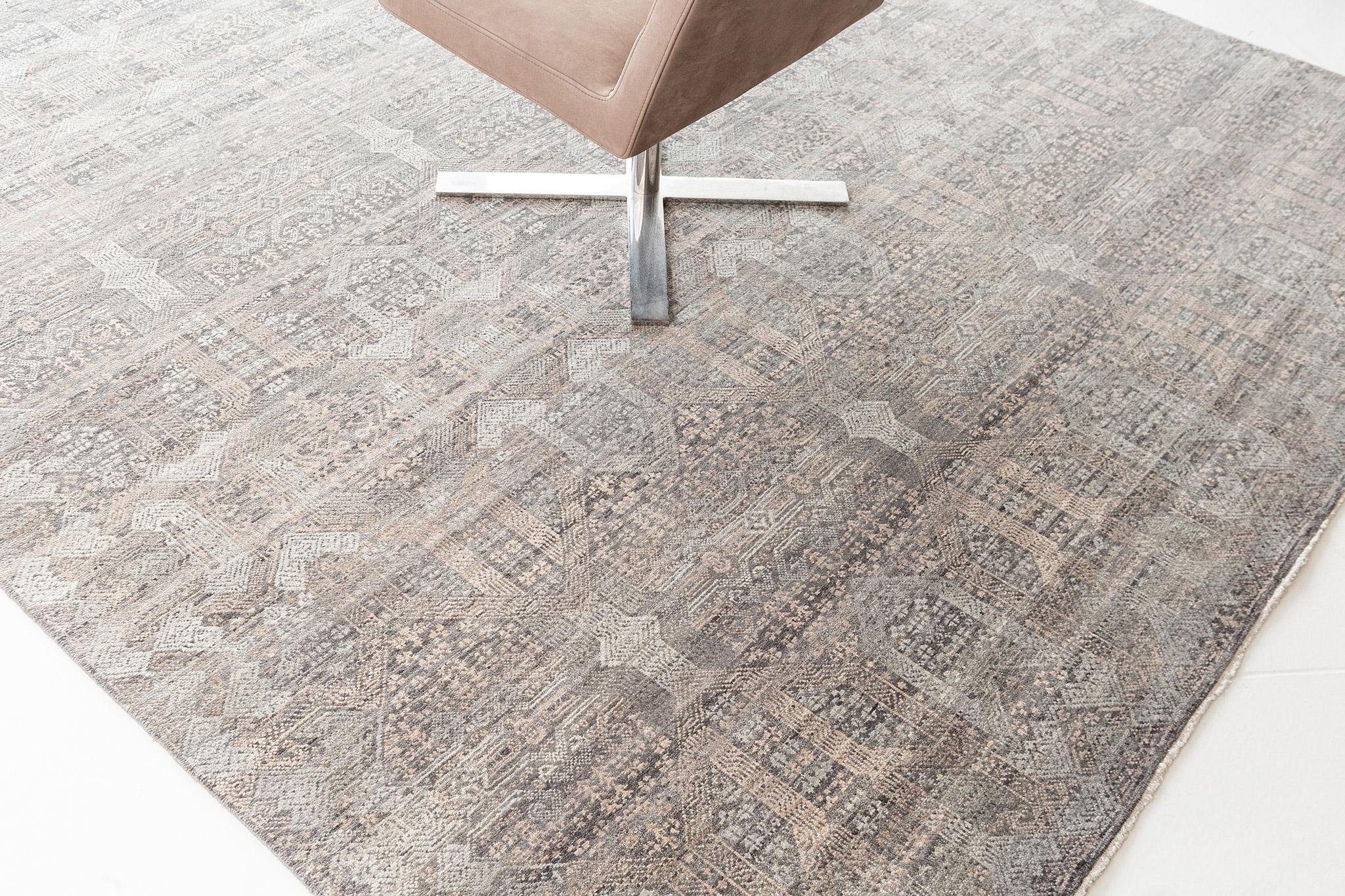 A breathtaking transitional design rug that features the variegated deep tones of gray, camel and ivory. All-over patterns of Indian inspired elements, creates a sophisticated combination for this work of art. Simply put, this captivating creation