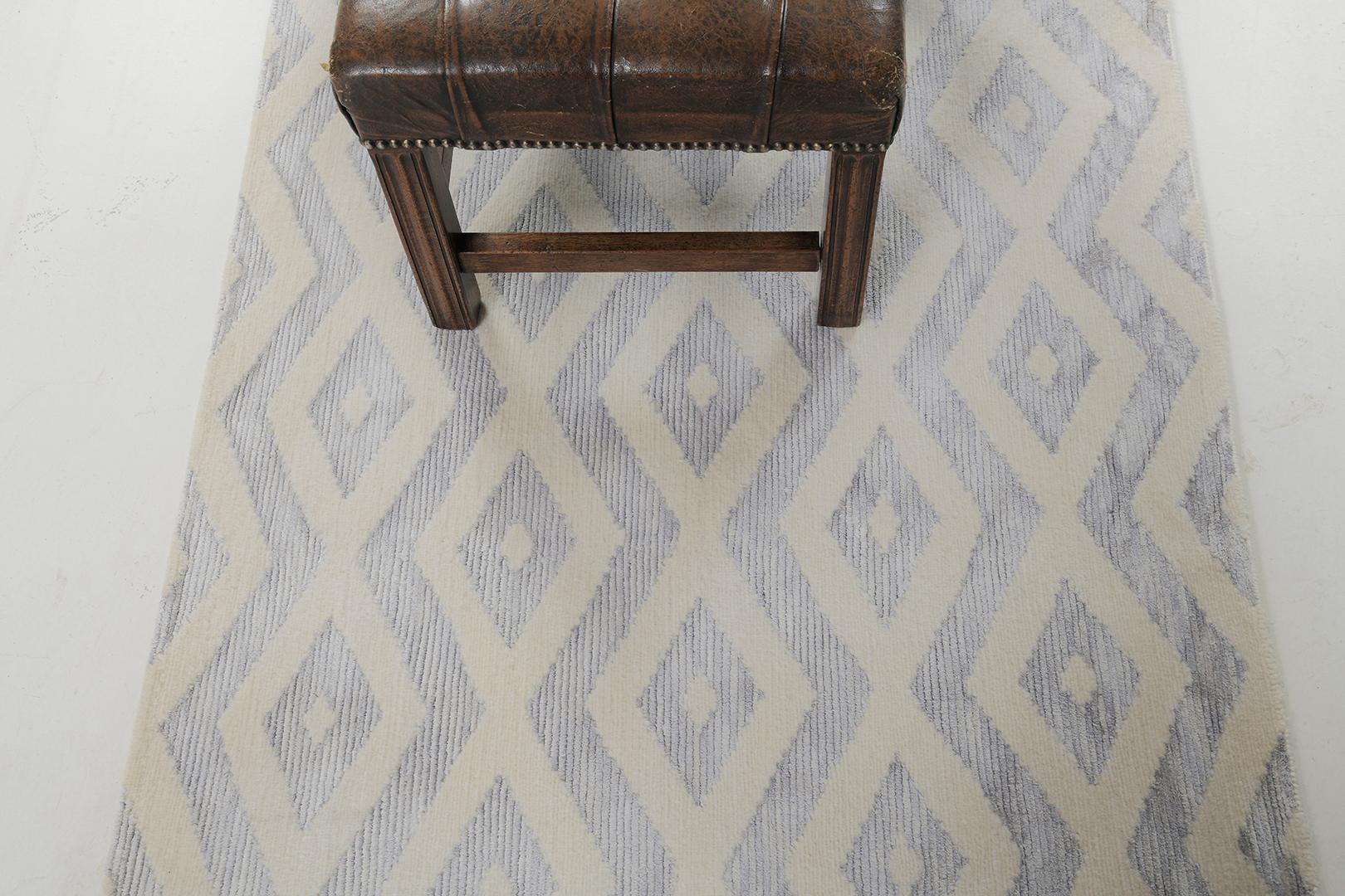 Quadri is a unique transitional design from the Allure collection is the epitome of grace and sophistication. Quadri is a wool and silk pile weave that intricately weaves ivory and variegated tones of blue to perfection.

Rug