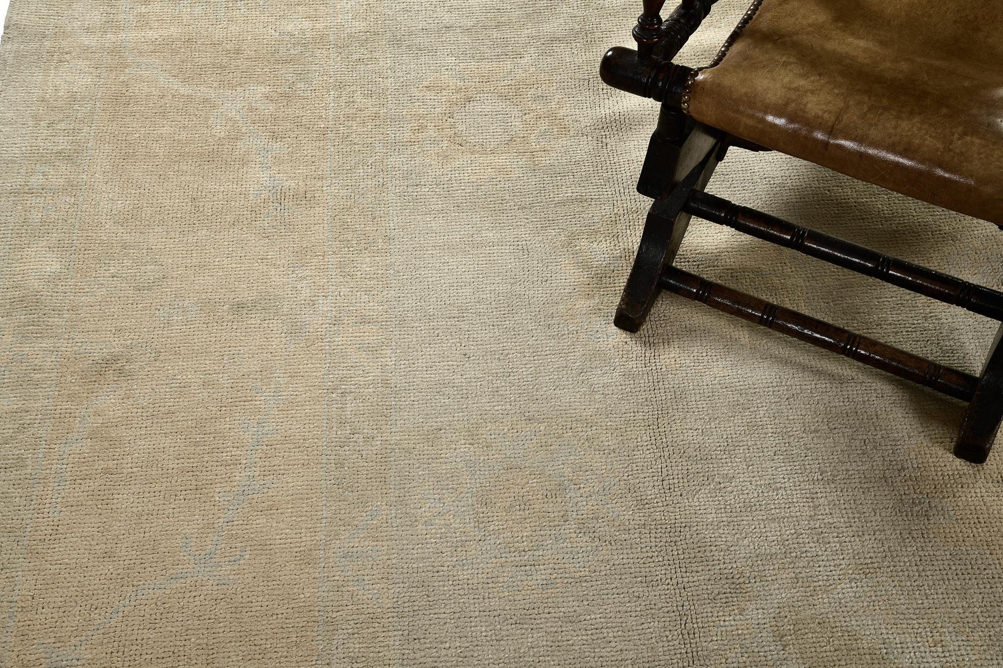 A captivating sandy beige and dusty blue muted revival of Oushak design rug that was made from the finest selection of natural dye and hand spun wool. The rustic character of this breathtaking rug will tone down a formal design scheme and give your