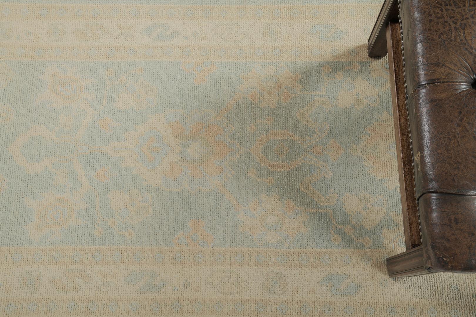 Sage blue, gold, khaki, and teal-gray predominate in this revival of the Turkish Oushak runner. The design features a prominent medallion enclosed by patterned motifs. Adding this masterpiece to your collection will surely be a great augment to your