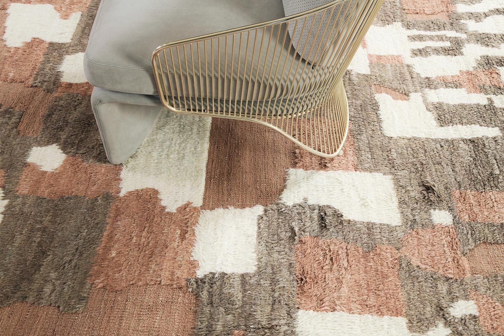 The Ussem rug is a pile woven wool piece inspired by Scandinavian design elements for the modern design world. The rug's shag balance and harmony, handwoven with playful shades of terracota toned flat weave with unique piles of ivory and umber