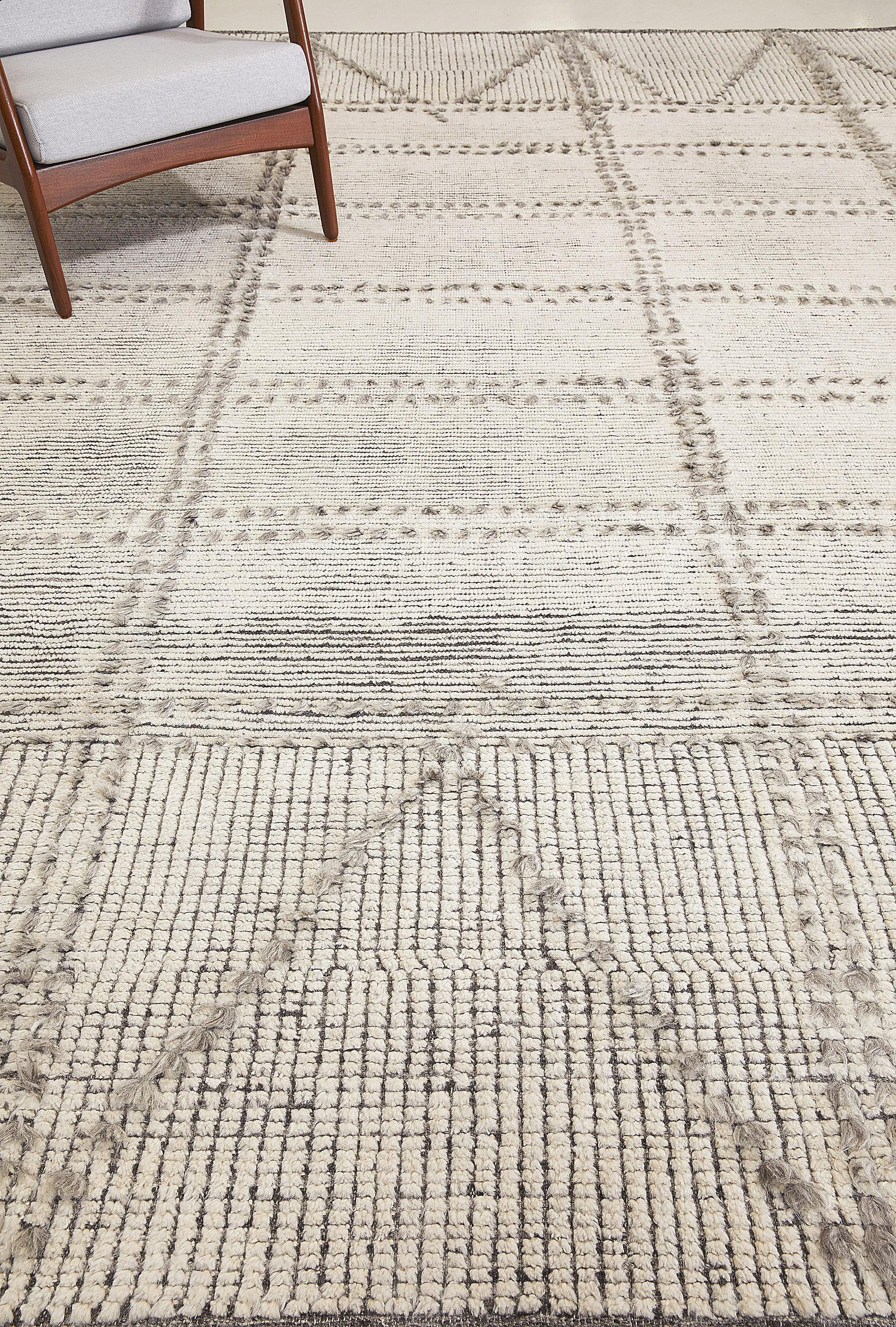 Valdepena’s long knots contrast with trim ribbed pile creating a harmony of texture and color. A linear motif finished in diagonal zags at top and bottom.

Here in dappled gray.

The Estancia Collection by Mehraban is a group of casually