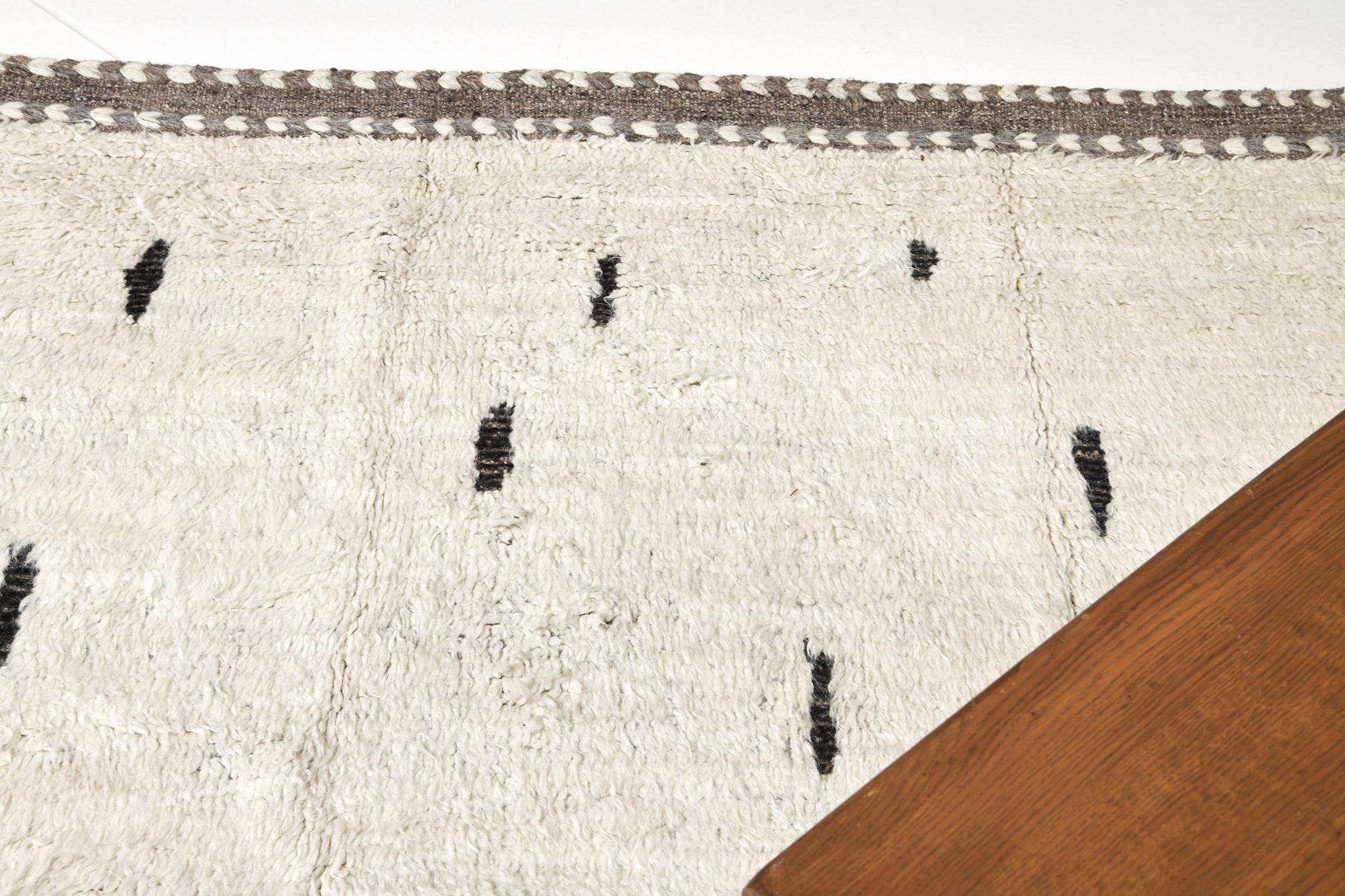 Vinos' is made of luxurious wool and timeless design elements. Its weaving of the perfect ivory field and sporadic charcoal piles creates a unique design and is what makes the Atlas Collection so unique and sought after. Mehraban's Atlas collection