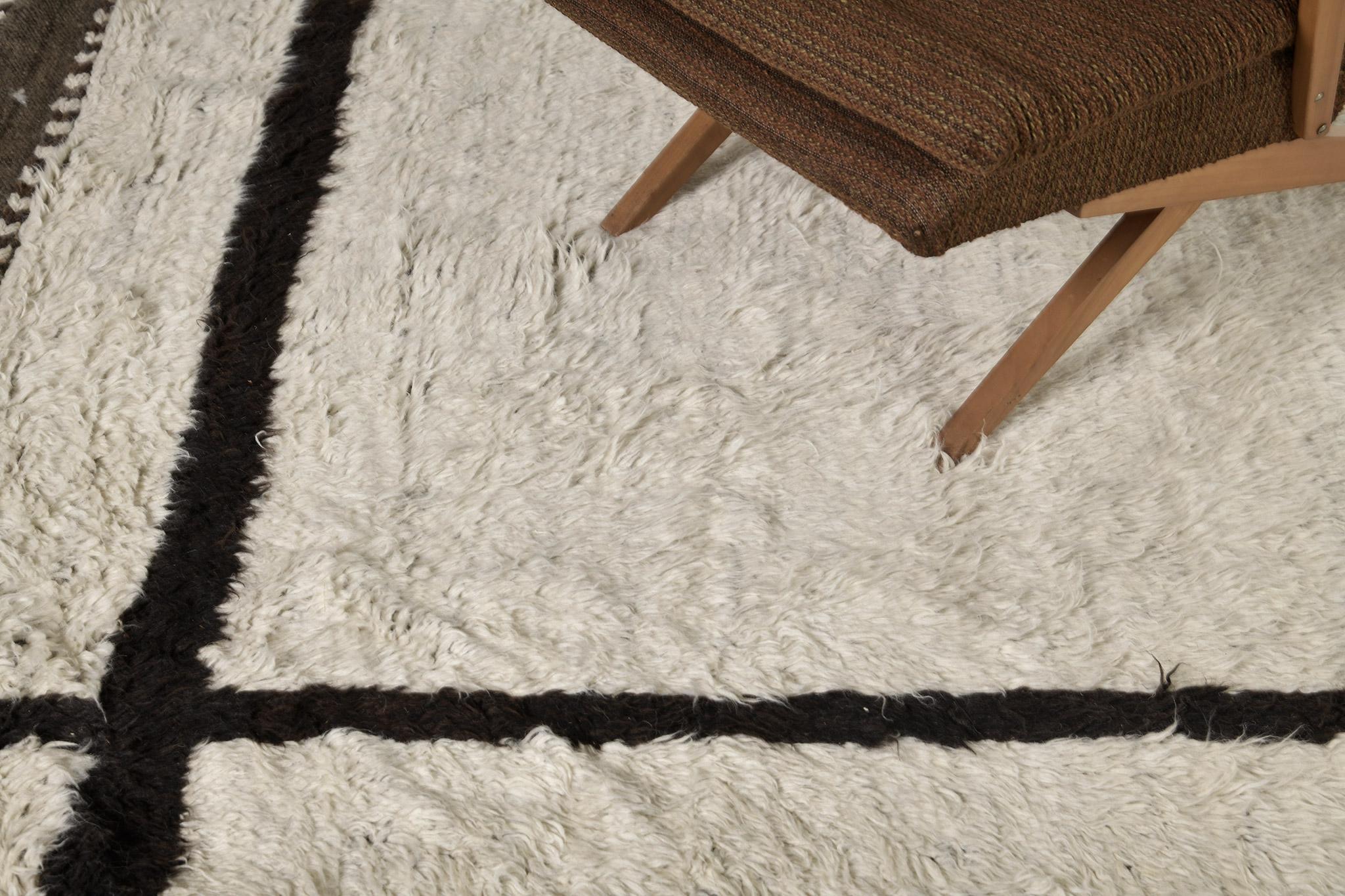 Vinos' is made of luxurious wool and timeless design elements. Its weaving of the perfect ivory field and sporadic umber brown piles creates a unique design and is what makes the Atlas Collection so unique and sought after. Mehraban's Atlas