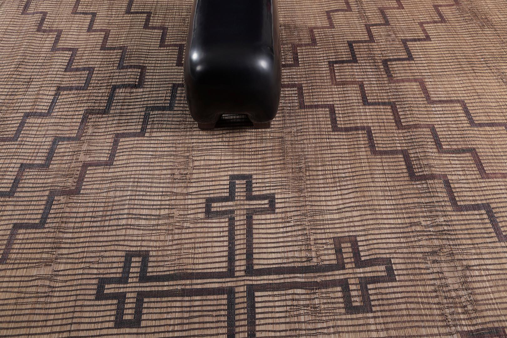 Tuareg Mat is a gorgeous reed and leather that uses linework and geometrical Berber symbols that tell of history. Neutral schemes are added to strengthen the creativeness of the designer. Mehraban's Tuareg Mat collection is noted for its durability