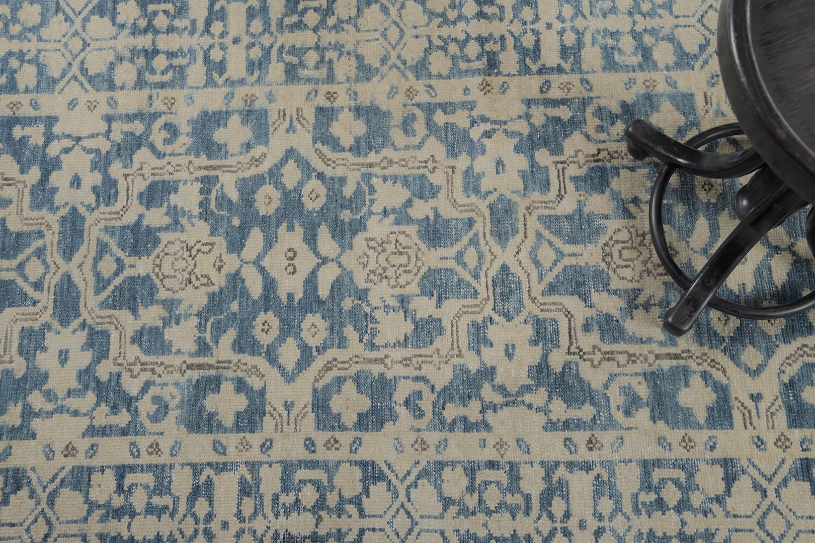 This majestic revival Persian Malayer vintage rug comes from a handmade finest wool that features neutral-toned symmetrical florid elements, glorious foliage, and stylized motifs over the midnight blue field. With its impressive pattern, it is easy
