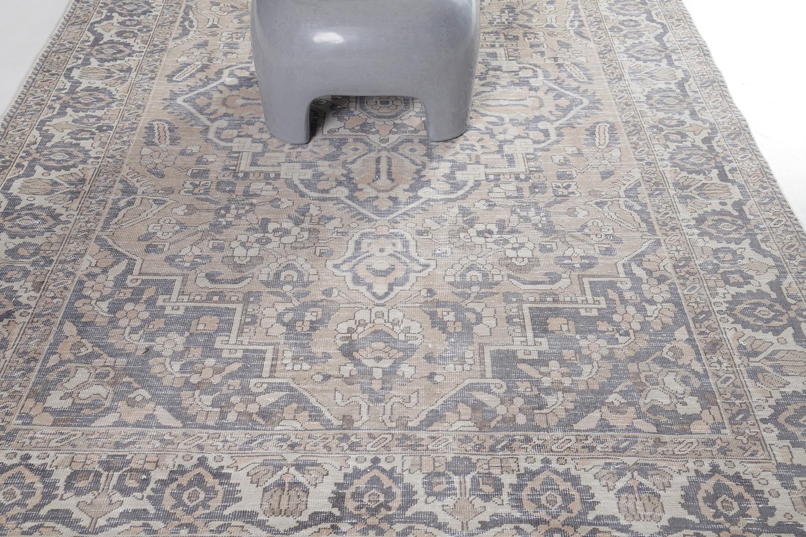 A stunning creation of this Bakhtiari Vintage Rug flexed its hand-spun wool for durability and individuality. Calming gray and neutral schemes are featured that will match your traditional interiors. Aside from its aesthetic value, it is also
