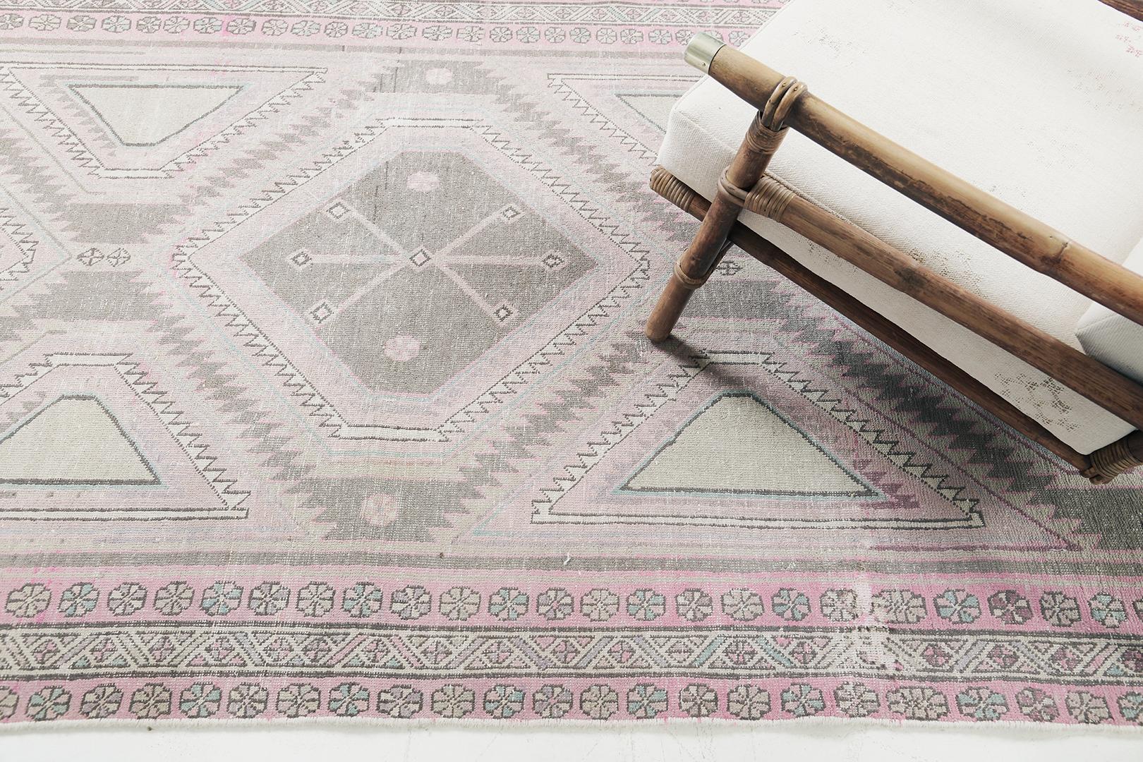 Featuring an impressive collaboration of awe-inspiring colour palette, this Vintage Persian Bakhtiari rug embodies three lozenge statement medallions that leaves an impeccable impact. Various geometric and florid images display beautifully along the