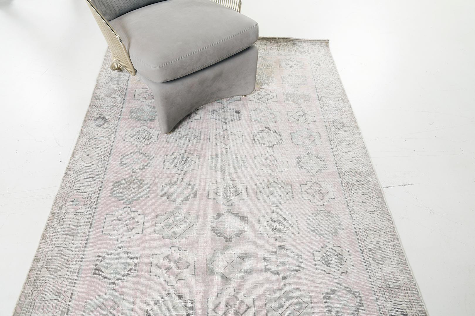Featuring a mesmerizing collaboration of awe-inspiring colour palette, this Vintage Persian Bakhtiari rug embodies a series of stacked embellished lozenge medallions that leaves a captivating impact. This fascinating Bakhtiari rug is well-suited for