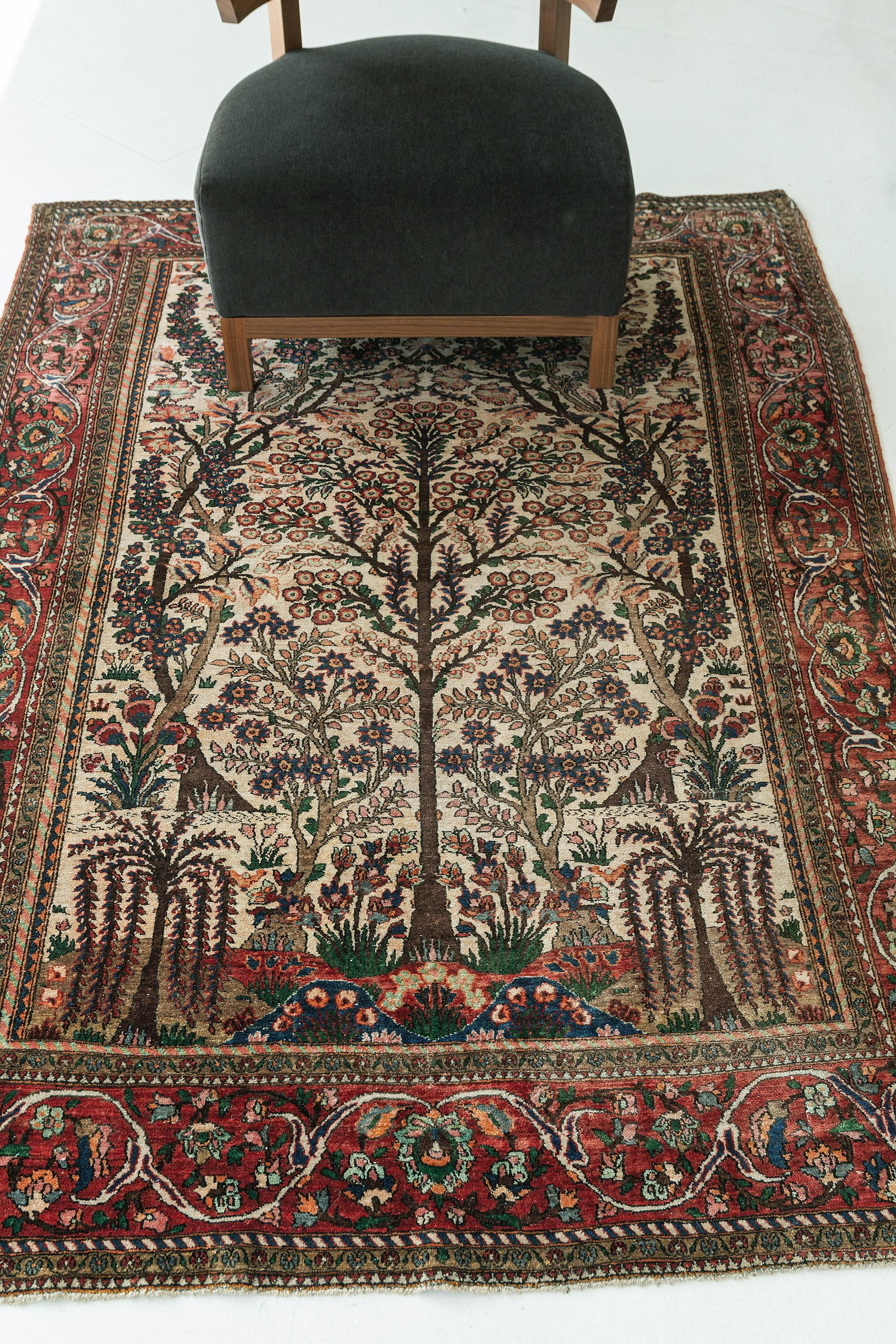 This finely crafted Vintage Persian Isfahan rug features an all-over botanical pattern of hyacinths, stylized florals and blooming palmettes. The field is patterned with dramatic curvilinear leaves, with lavish flowers interspersed throughout the