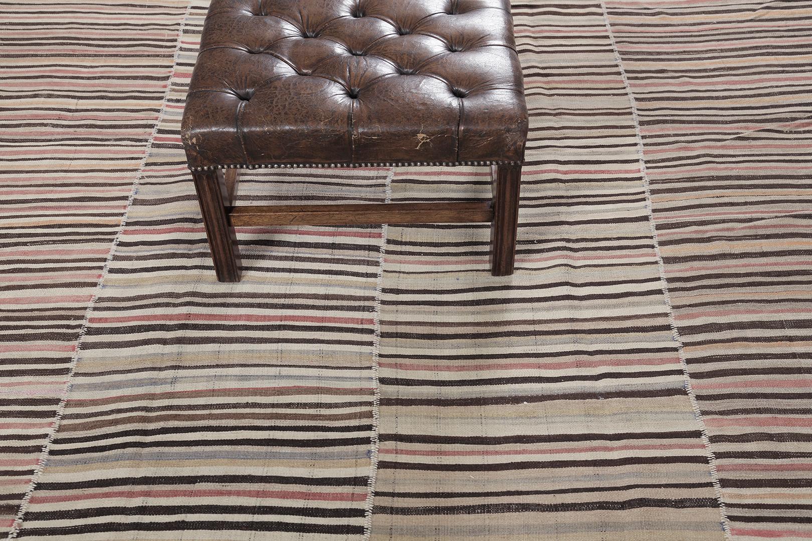 This Persian Jejim Kilim is a banded flat weave with alternating hues of red, ivory, khaki, and clay brown in multi-column stripes. Persian flatweaves are made up of some of the best wool and weaved exceptionally to create interesting textures. This