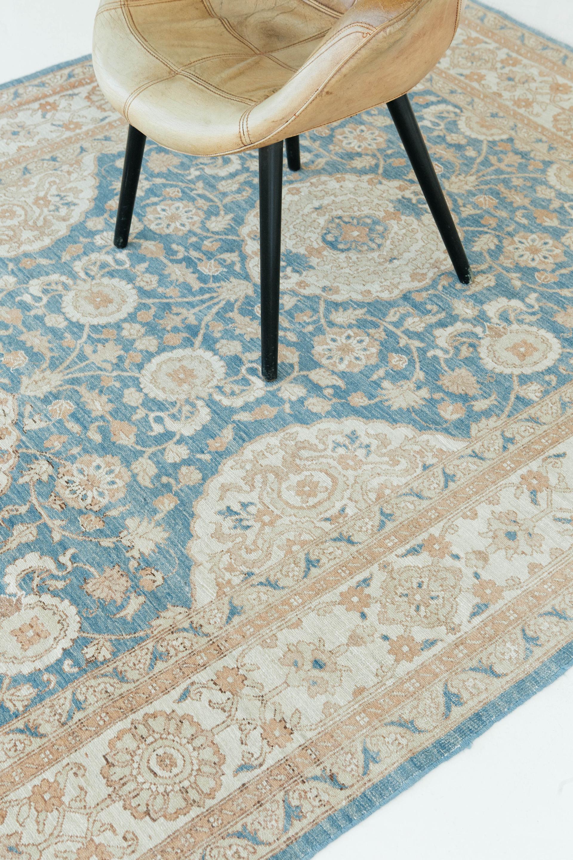 This pile woven texture rug of Amritsar, has a distinctive Indian design with a precise colonial influence. While the rug displays natural colors, a cool translucent shade of blue complemented by a border of brown hues, creating a dramatic effect