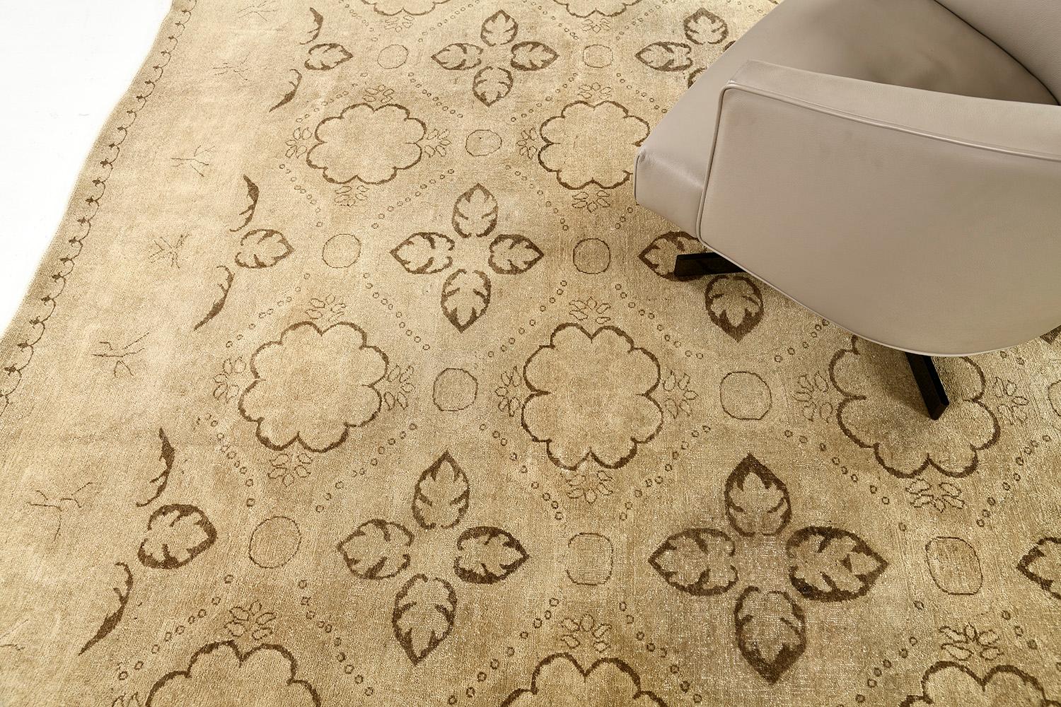 An incredible revival of Arts and Craft Style rug that features the most sought-after elegant muted tones. Laying gracefully in a sandy field, the blooming palmettes and ornate botanical patterns are formed symmetrically and enclosed by a classy