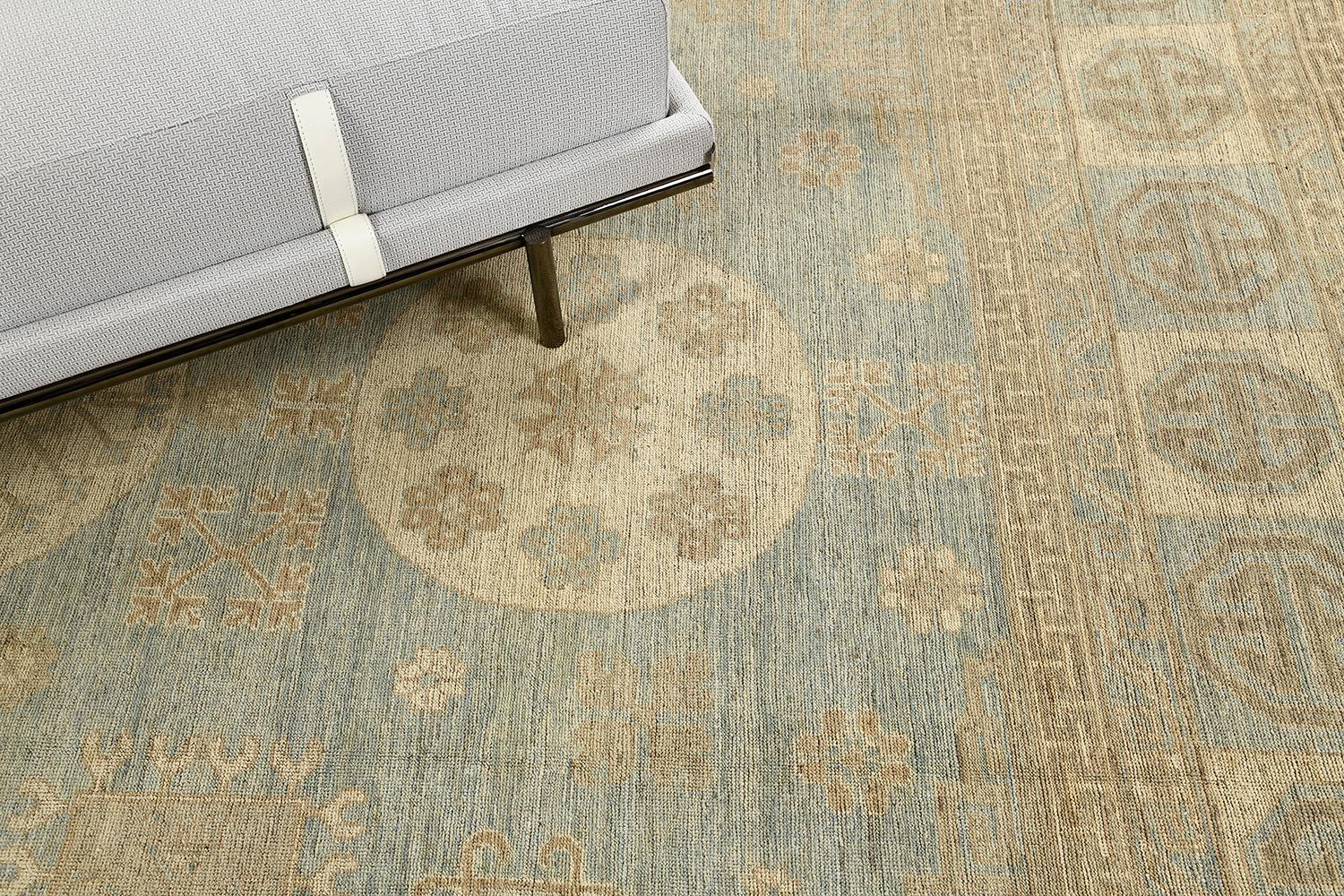 A grandoise revival of Khotan rug that establishes an exceptional character by the intricately incorporated elements and satisfying colour selections. The relaxing effect by the abrashed cornflower blue field makes the three central medallions stand