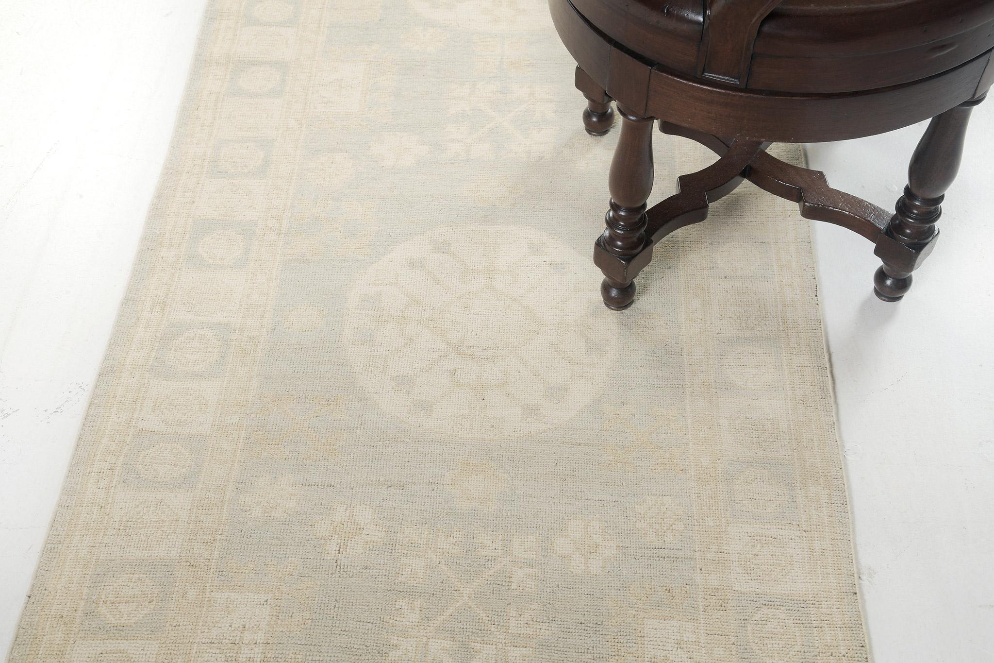 Featuring our Khotan Vintage-styled runner with alternating light and dark patterned borders. This rug works to bring together several decorations. Florid elements and medallions are perfectly established with a muted tone of camel, coffee, and gray
