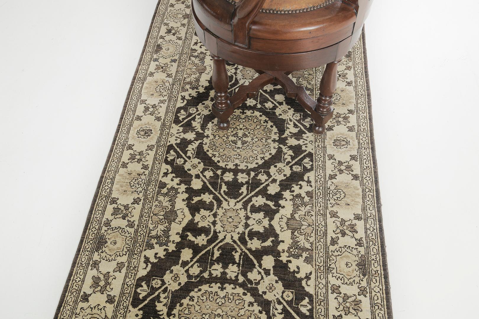 This glorious revival of the Mahal rug has created an amazing pattern. It features well-coordinated florid elements to neutral tone in mocha, umber brown, and cream accents. This elegant rug is embellished with enchanting symmetrical patterns in the