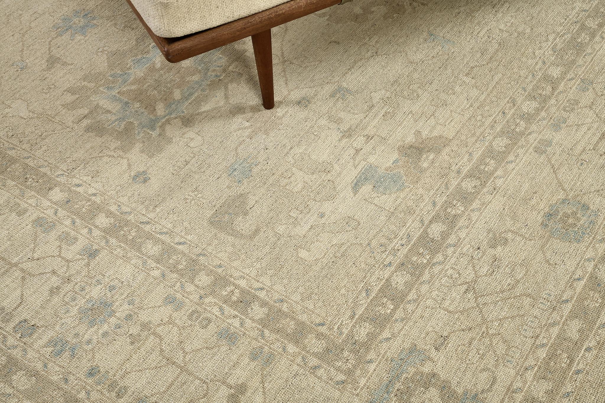 This incredibly woven Oushak Design rug showcases the botanical patterns that are simultaneously displayed all over the magnificent sandy field resulting in a captivating impression of creativity in the traditionally represented motifs. Dreamy and