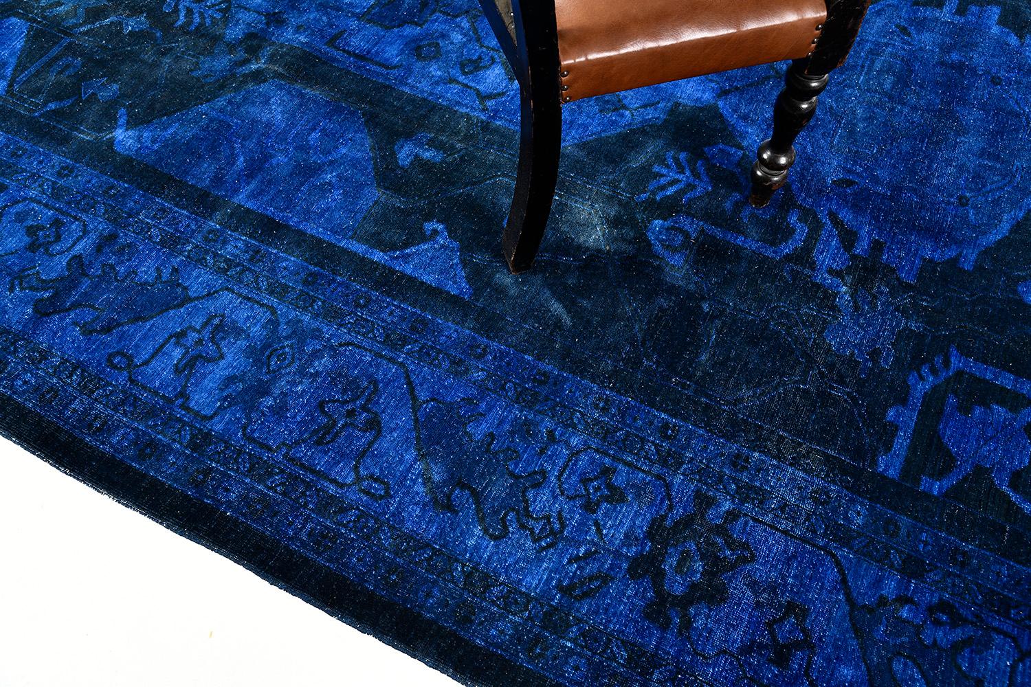 This blue overdyed raptured rug is an instant masterpiece. With its understated design and style, this woven piece of art exudes elegance from every thread. The wool is soft and supple, but durable to last a lifetime. A decor that would be loved by