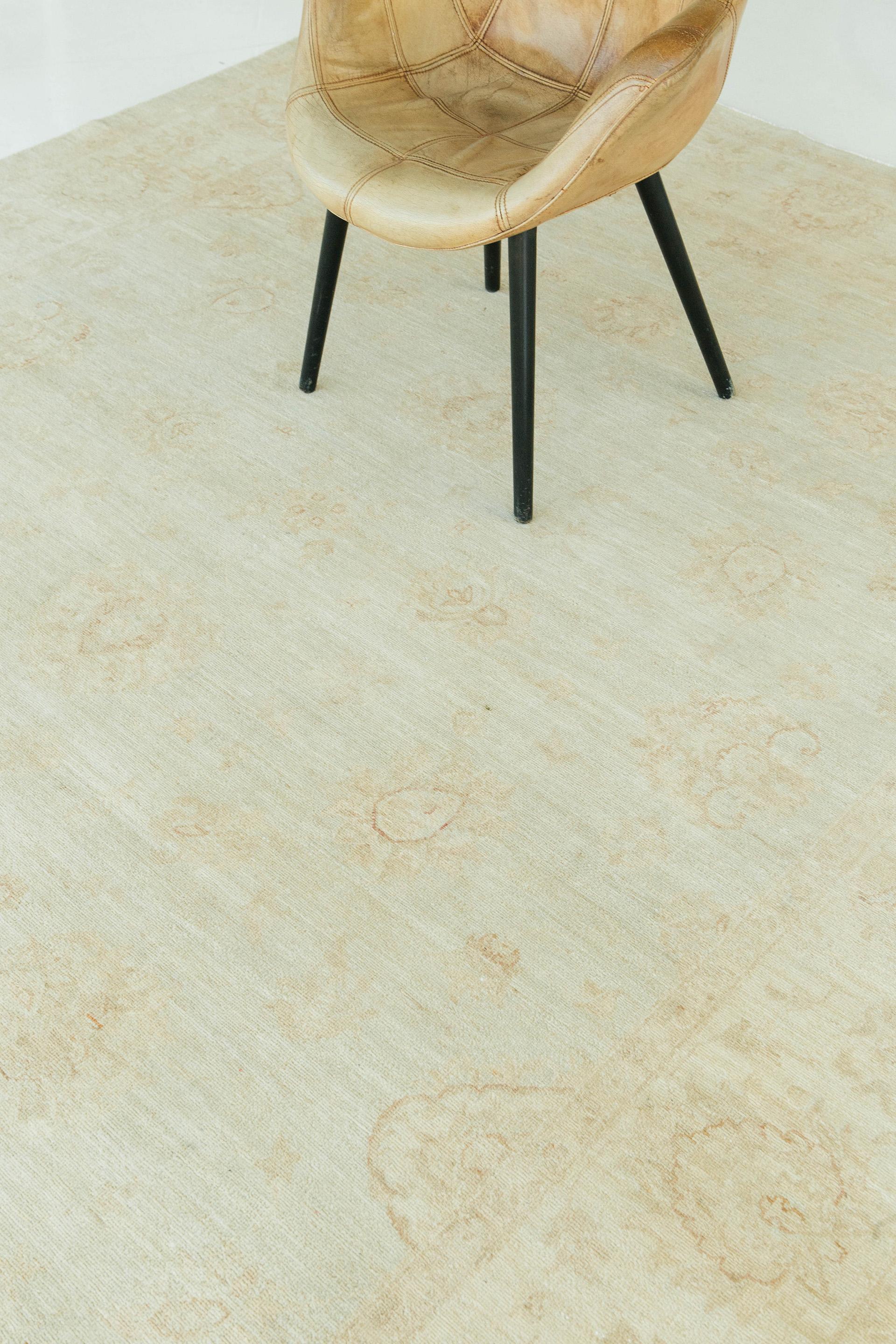 The Sultanabad rug's magnificent blossom field designs are made from hand-spun wool, giving them an artistic touch. To give over its elegance, cream and beige tones highlight the eye-catching details. By using it as a center piece, the rug's