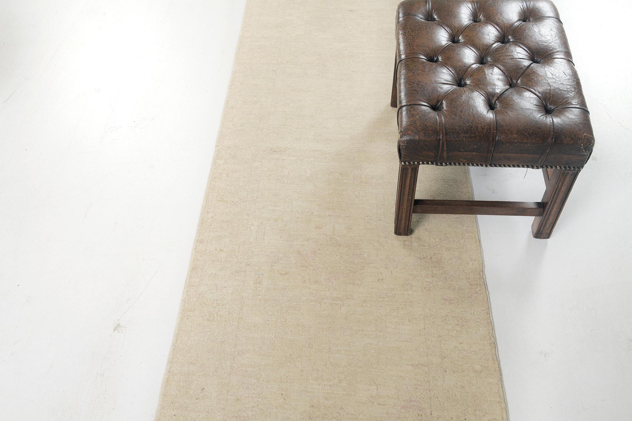 Impressive ambiguous elements and faded florid adornments are expressed through the rapture technique. Close to plain sage green it is still beautifully hand-woven to form an elegant Sultanabad Runner. A stunning creation that best suits both