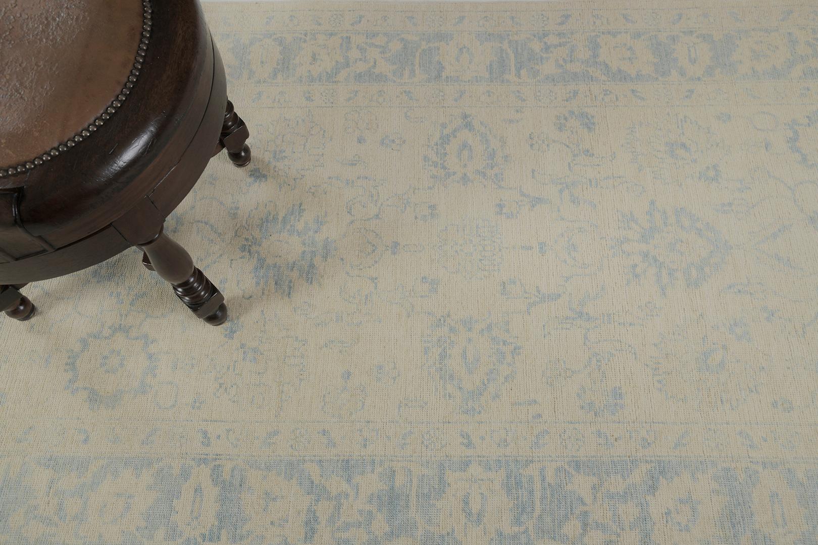 This remarkable masterwork of our Safira Collection lets your soul desire the comfort of muted tones of blue and gray on this rug. The main borders have florid patterns that are aligned and well-coordinated symmetry of gorgeous motifs. The gorgeous