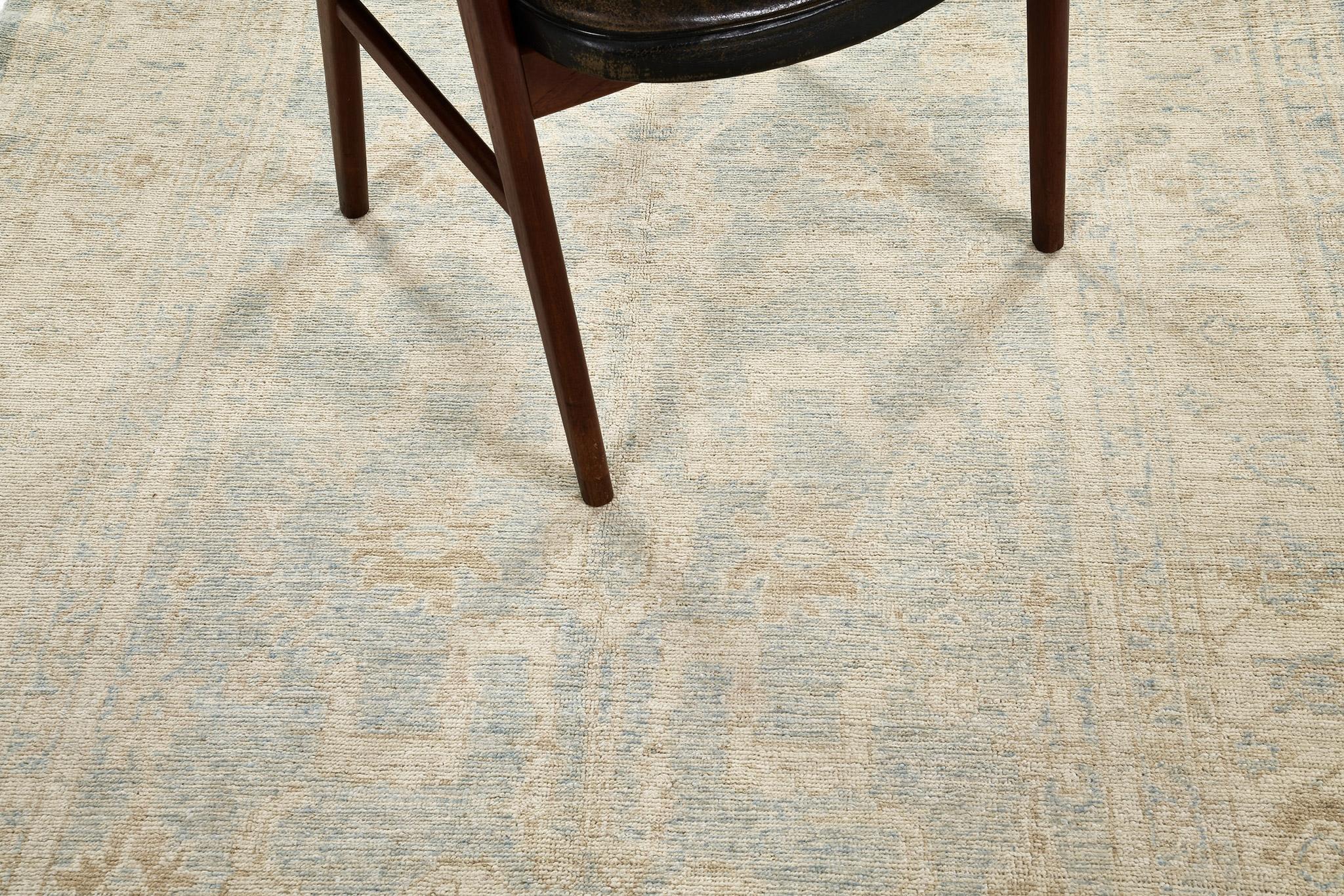 Featuring the fascinating tones of cerulean blue, gold and ivory, this Sultanabad rug in our Safira collection will definitely leave you in awe. The allover blooming patterns with gracefully strewn leafy tendrils are enclosed with alternating