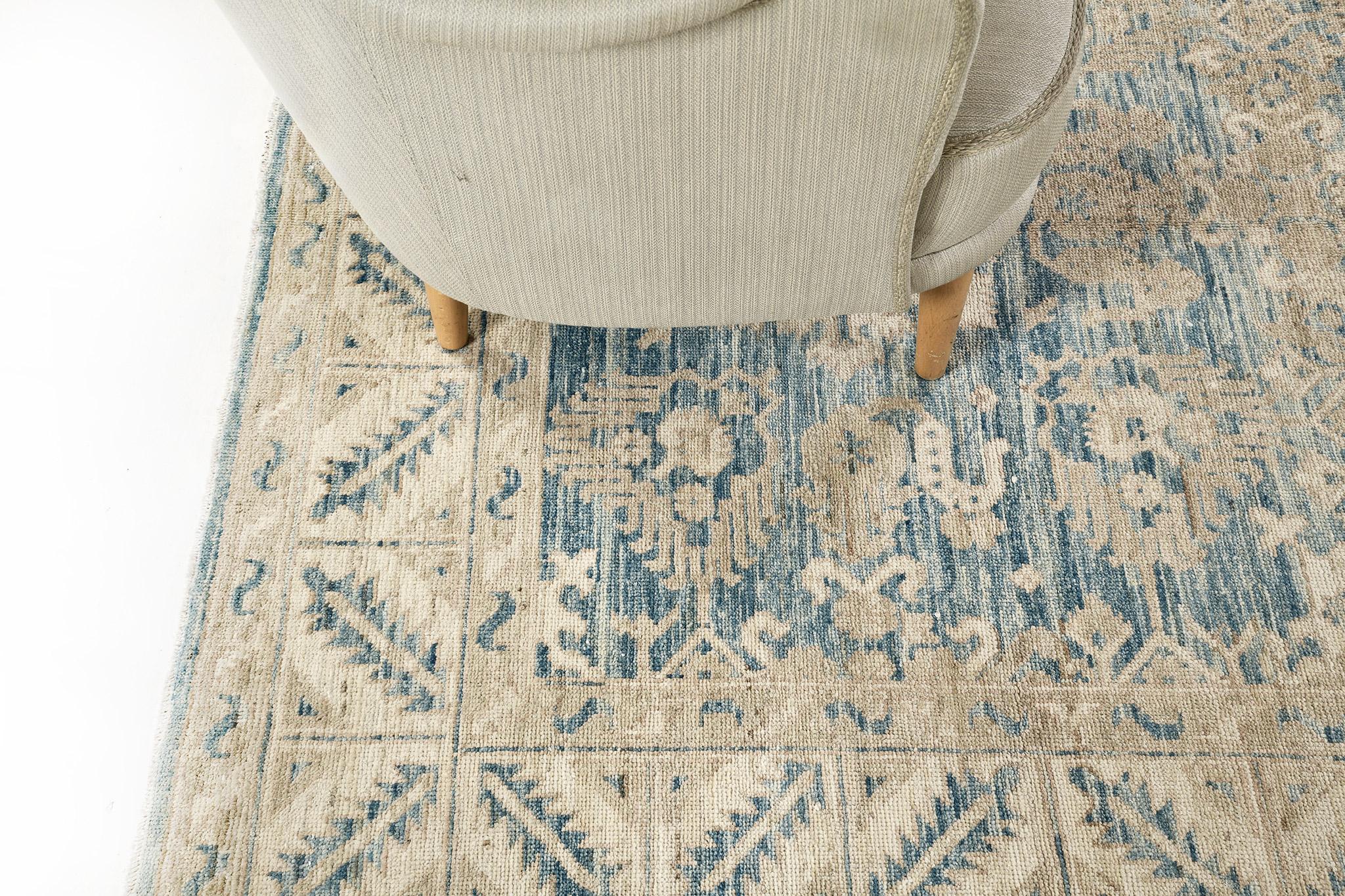 A glorious revival rug in Safira Collection with muted tone palette showcasing its striking appeal and brilliant architectural elements. This elegant rug can perfectly fit into a contemporary, modern and traditional interiors. It features a cobalt