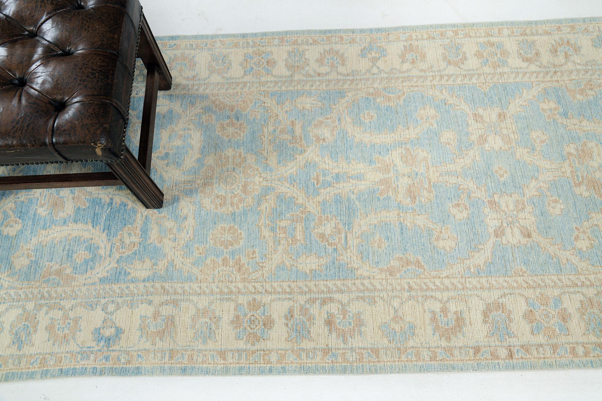 Remarkable vines are engaged with various embellishments and symbolic elements in oatmeal, cream, and gold accents in the cerulean blue field and are featured together with stunning borders that make the rug more charming. This will be an excellent