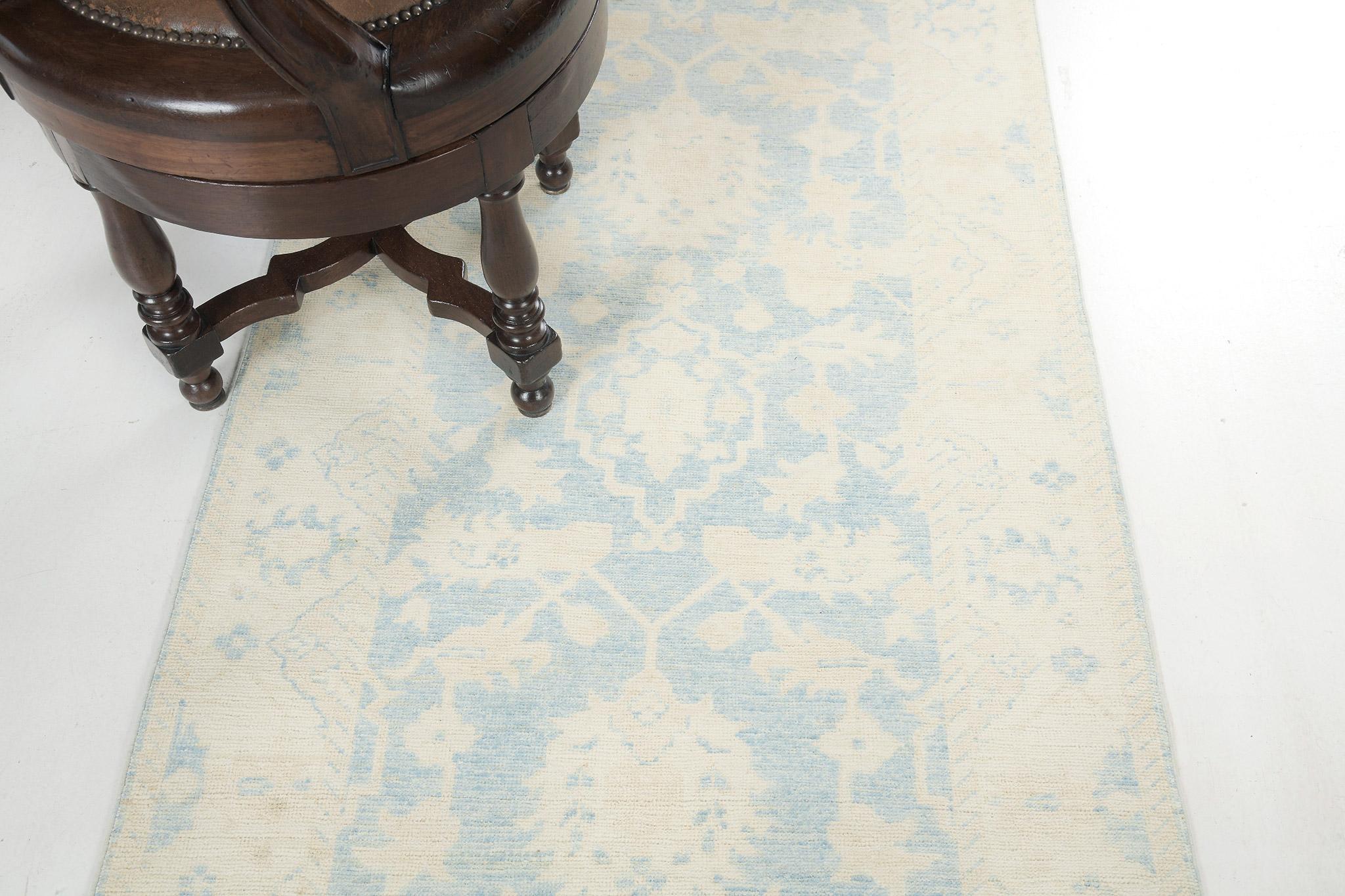 Incredible vines are fascinated with various embellishments and symbolic elements in a neutral tone and gold accents in the cerulean blue field and are featured together with stunning borders that make the rug more charming. This will be an