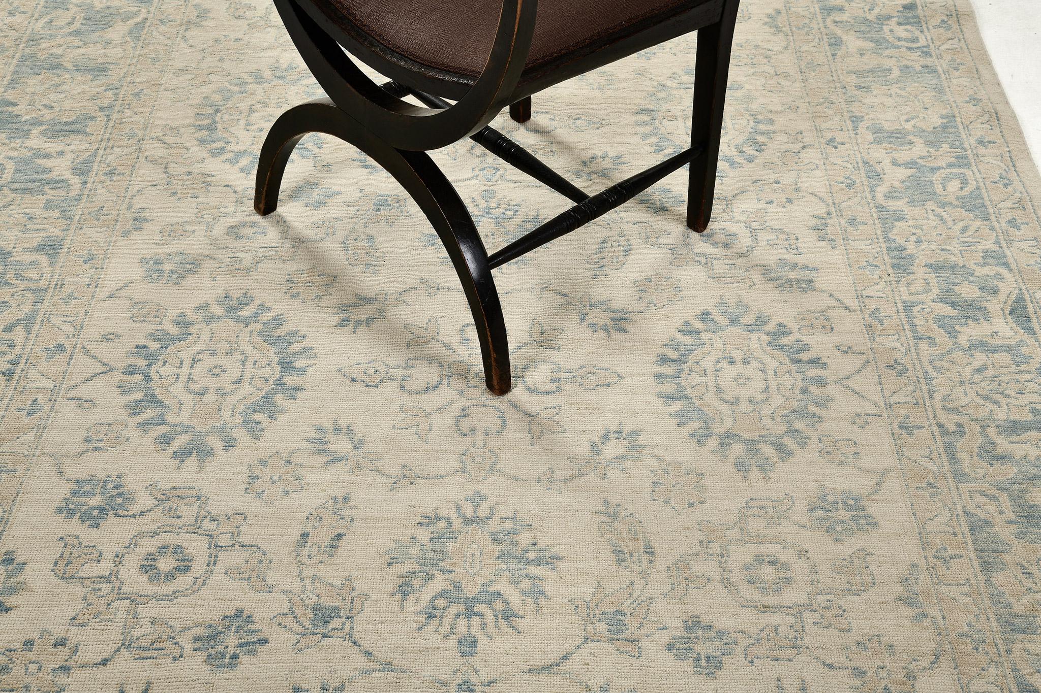 An elegant revival of Sultanabad design rug in the stunning muted neutral tones that come together and gave the feeling of genuine serenity. An all-over pattern of blooming palmettes and interconnected vines enclosed by an embellished ornate box