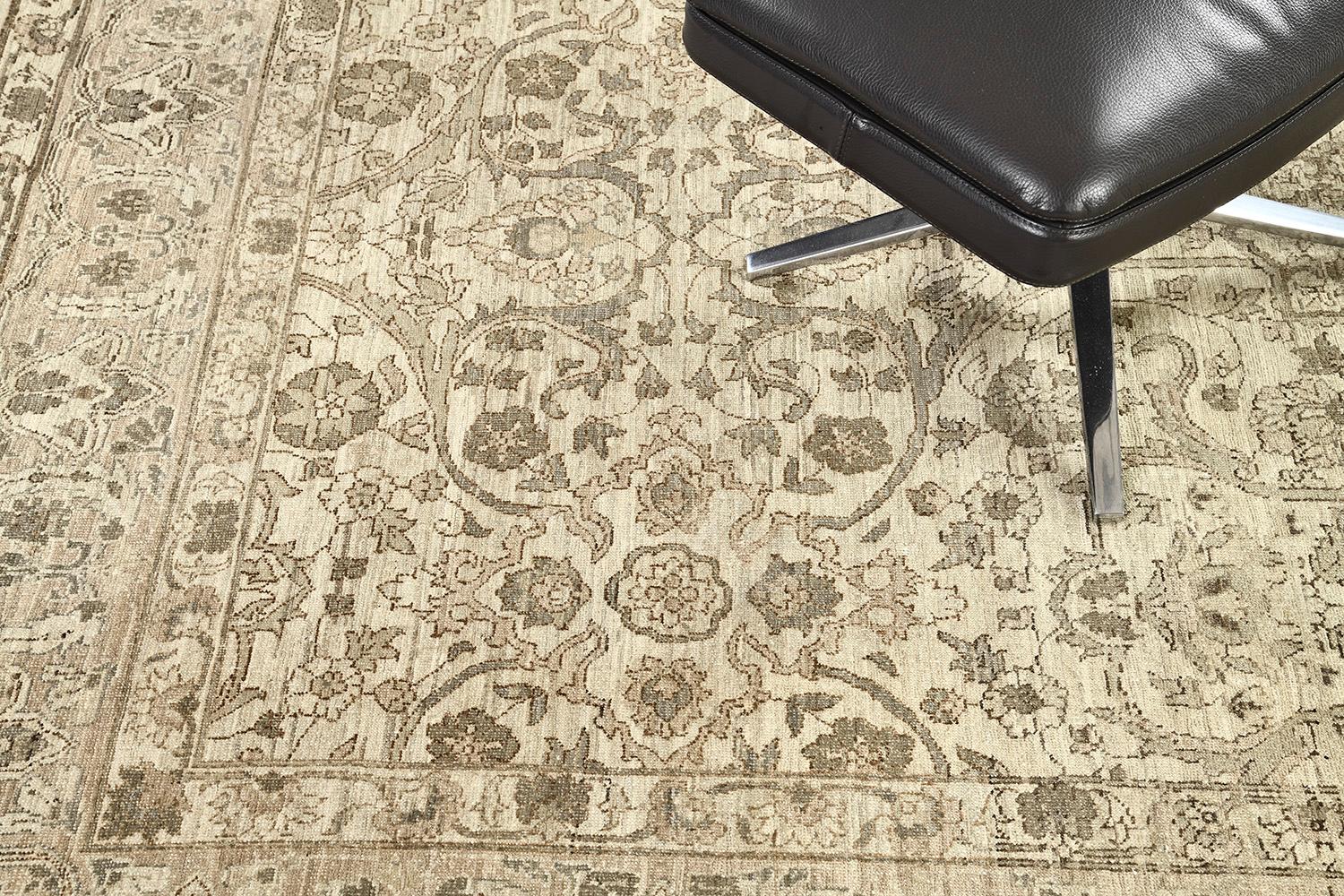 A laudable recreated vintage style Tabriz rug features blooming elements that intensify into a camel field. The main border contains an all-over lattice of issuing split leaves, mini palmettes, and a delicate flowering vinery that makes the rug more