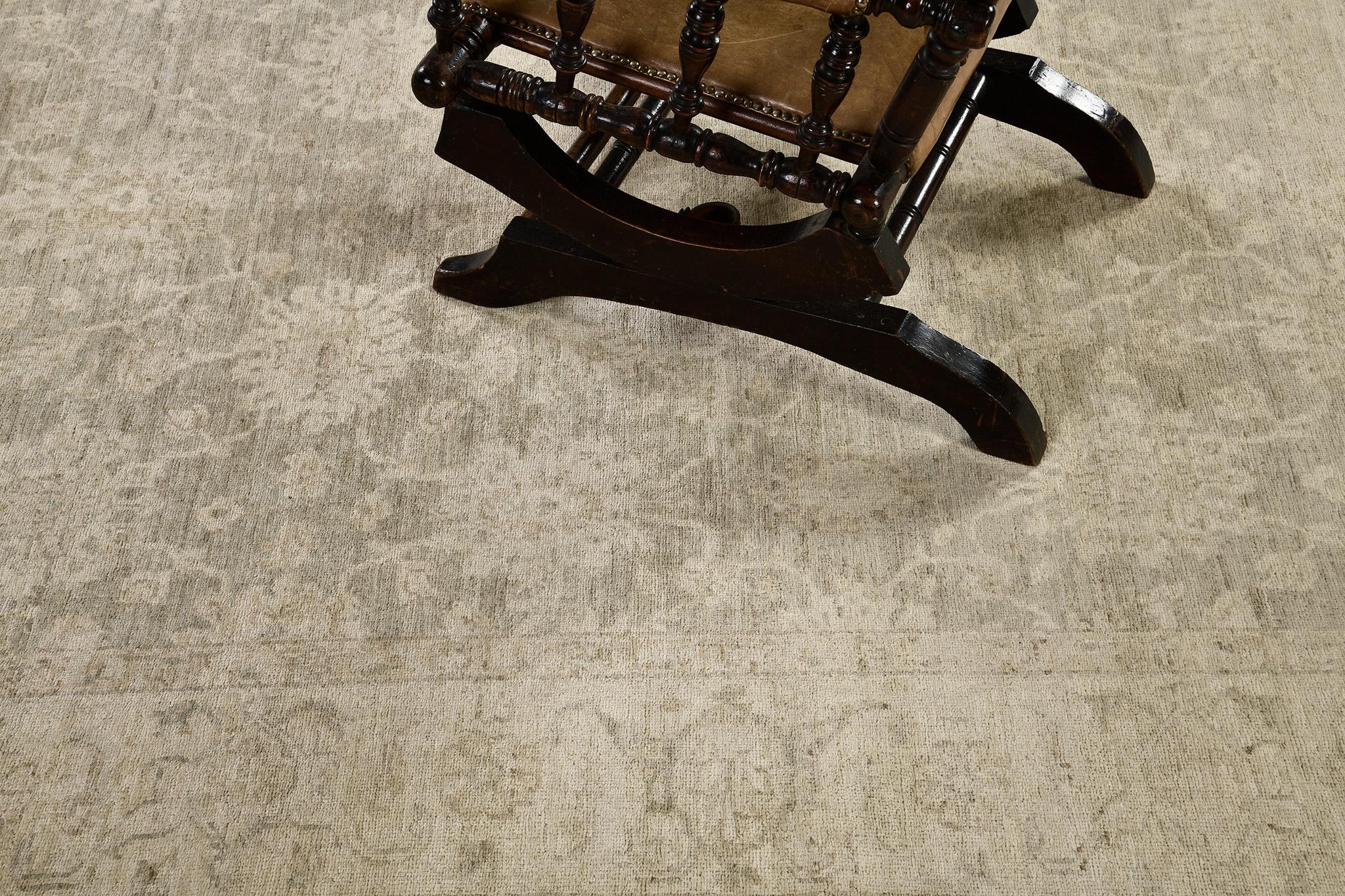 A sophisticated revival of Tabriz rug in Rapture Collection that elegantly establishes superior intricacy through botanical patterns of the blooming palmettes, leafy tendrils connected by graceful vines. Flanked by inner and outer floral guard