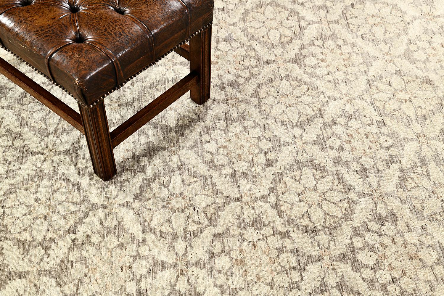 A meticulously hand-spun wool Transitional design revival from our most sought-after collection has come and flexed its versatility.  Majestically blooms in a neutral scheme manifest the entire pattern of the rug. This rug is flexible for any home