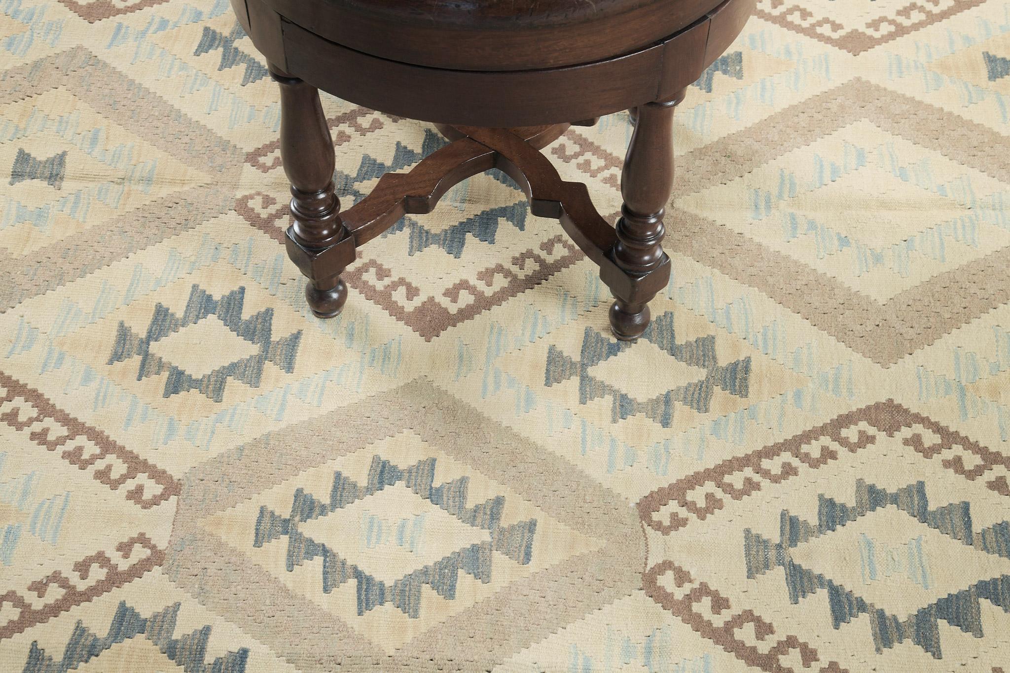 This remarkable vintage-style Tribal flatweave allows you to intensify your creativity and visions. It features the geometrical tribal design in muted cool tones that is pleasing to the eyes of your guests. A must-have collection that can be passed