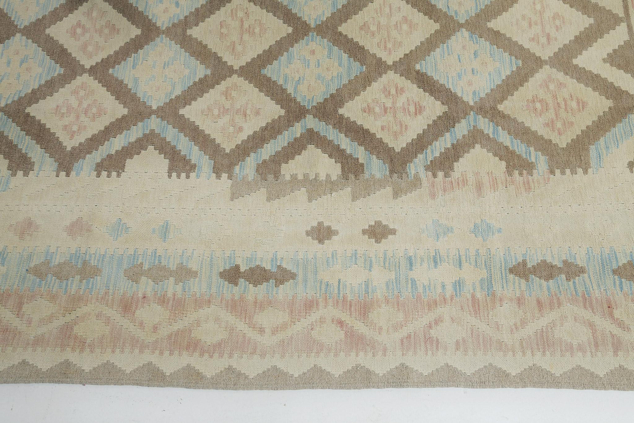 A stunning vintage-style Tribal flat weave banded with various geometric symbols and elements. Satisfactorily complemented with muted earth-hued diamond patterns that create a simple yet fascinating design for a vast variety of interiors. Its