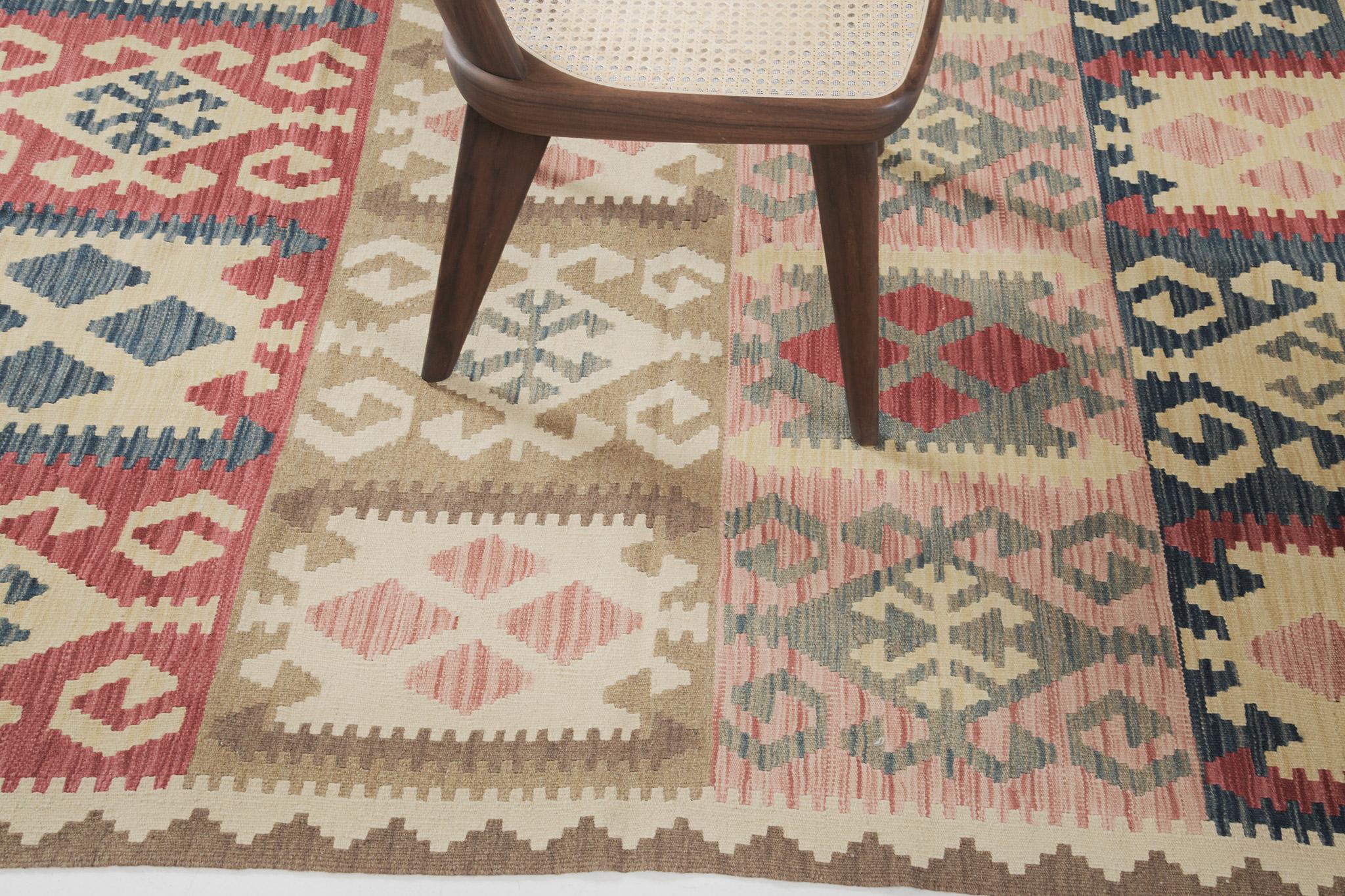 The motifs are in panel layouts that create a cheerful and amazing design for a large variety of interiors. A stunningly beautiful vintage-styled flatweave Kilim is banded with zigzag patterns, horns, and crabs in alternates of cream, red, midnight