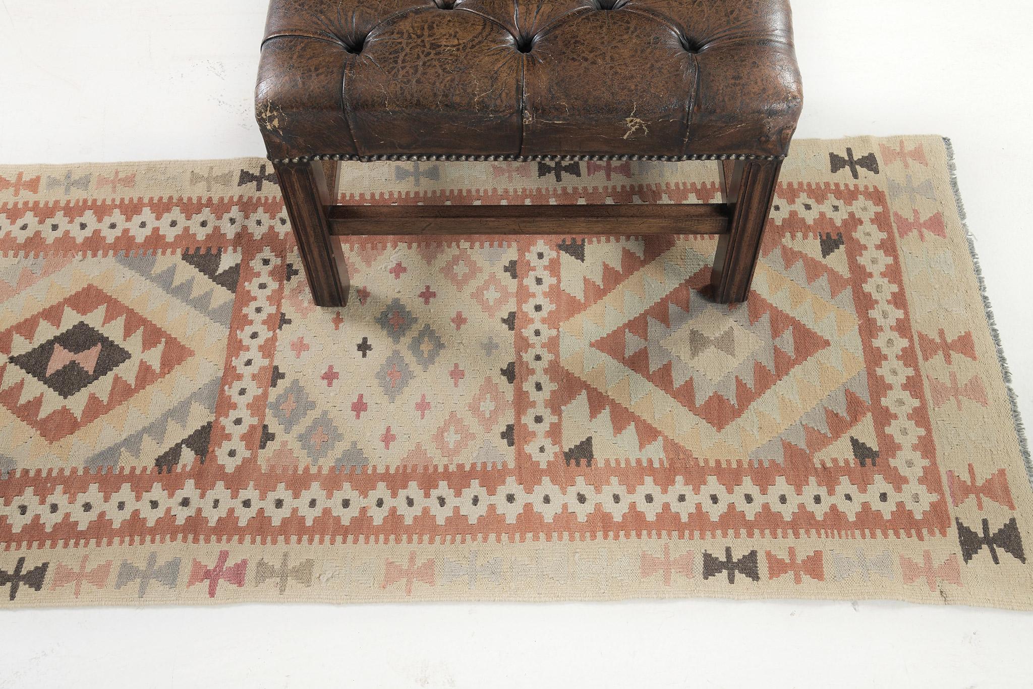 Uplift your room with so much history and complexity with our flatweave Kilim. It highlights the diamond patterns and tribal symbols on its core. These strong details brighten up the mood of every guest. Fashionable for every designed space that