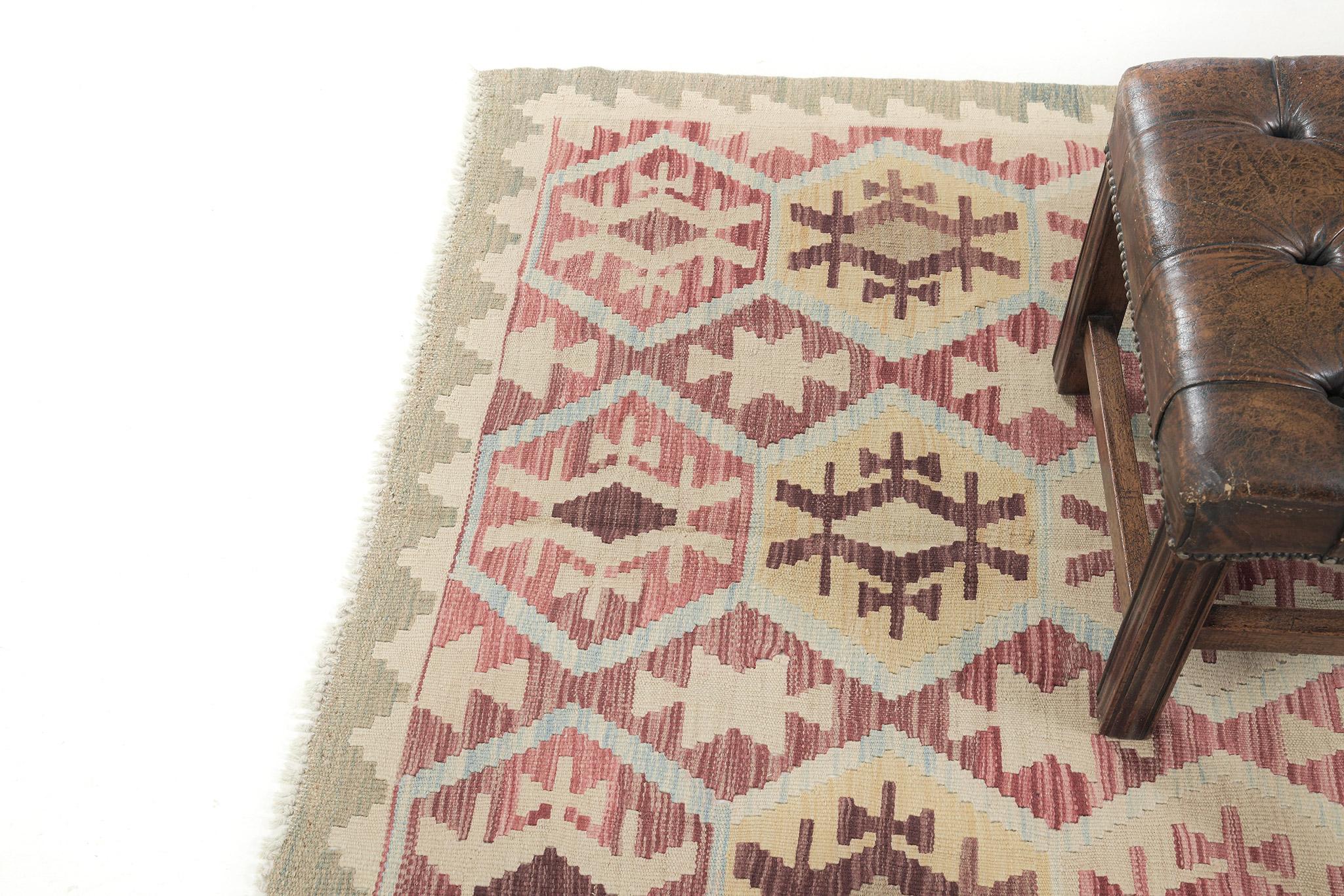 Stars and scorpion motifs are featured in this vintage style Kilim for the protection and happiness of the collector or owner. Red, yellow, and maroon are well-complemented with neutral borders. Best suited for traditional interiors and is a great