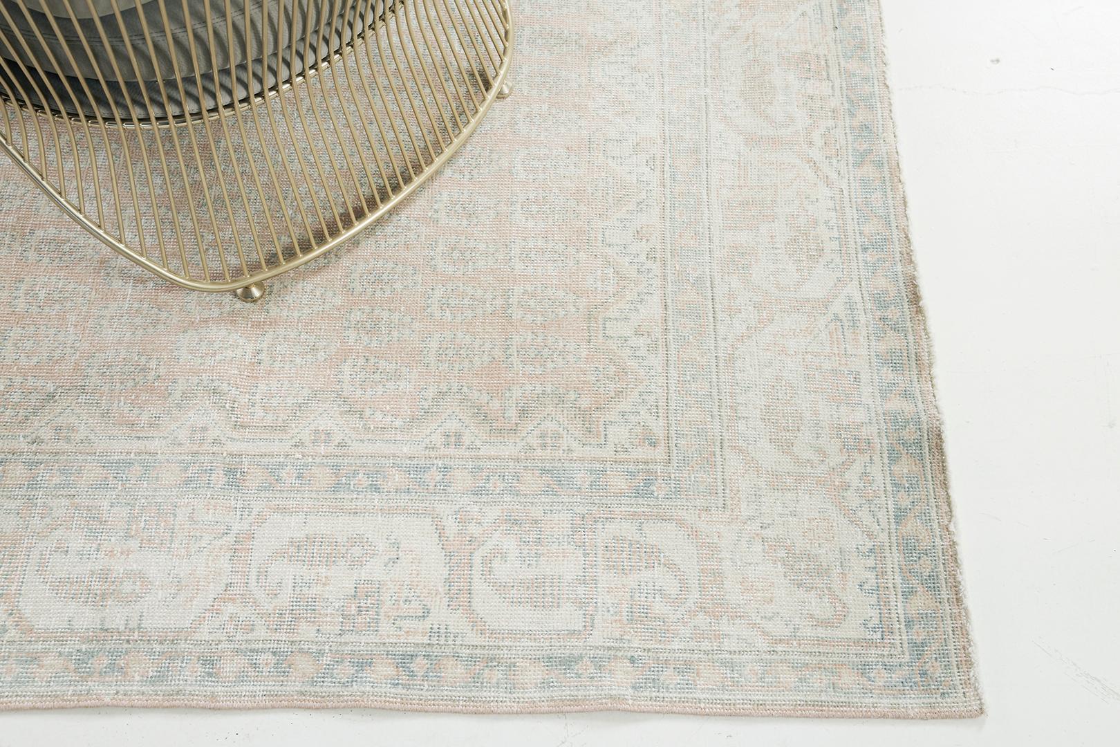 Soft elegance and warm earthy colors bring coordination to this Vintage Turkish Anatolian rug. It embodies the subtle Anatolian style featuring an allover botanical elements spread gracefully over the khaki field. A magnificent rug of timeless