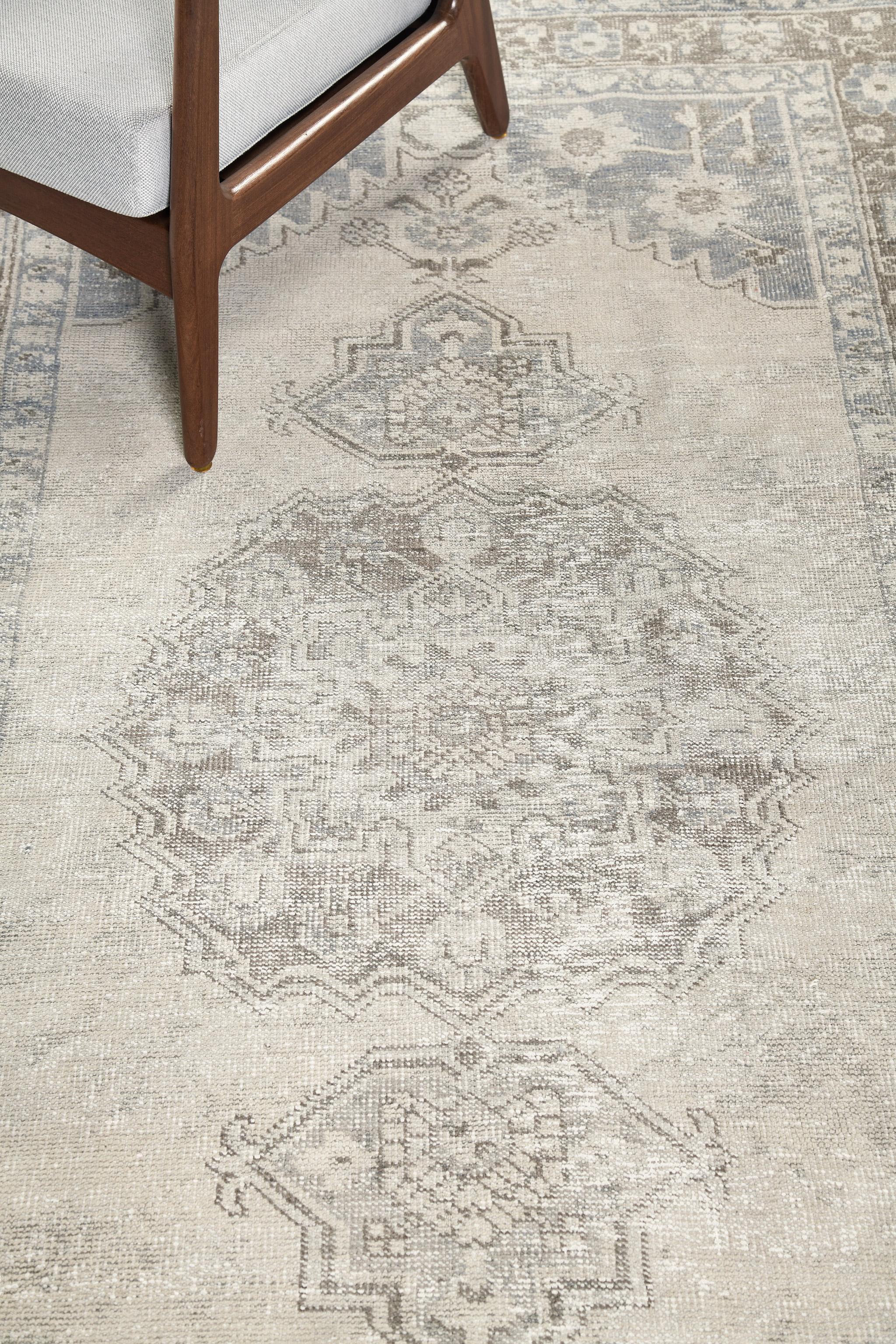 A stunning vintage Anatolian Turkish rug banded with a cool earth-toned palette. The grandiose medallion creates a dramatic yet interesting design for an extensive variety of interiors. A stylishly beautiful masterpiece that your guest will come